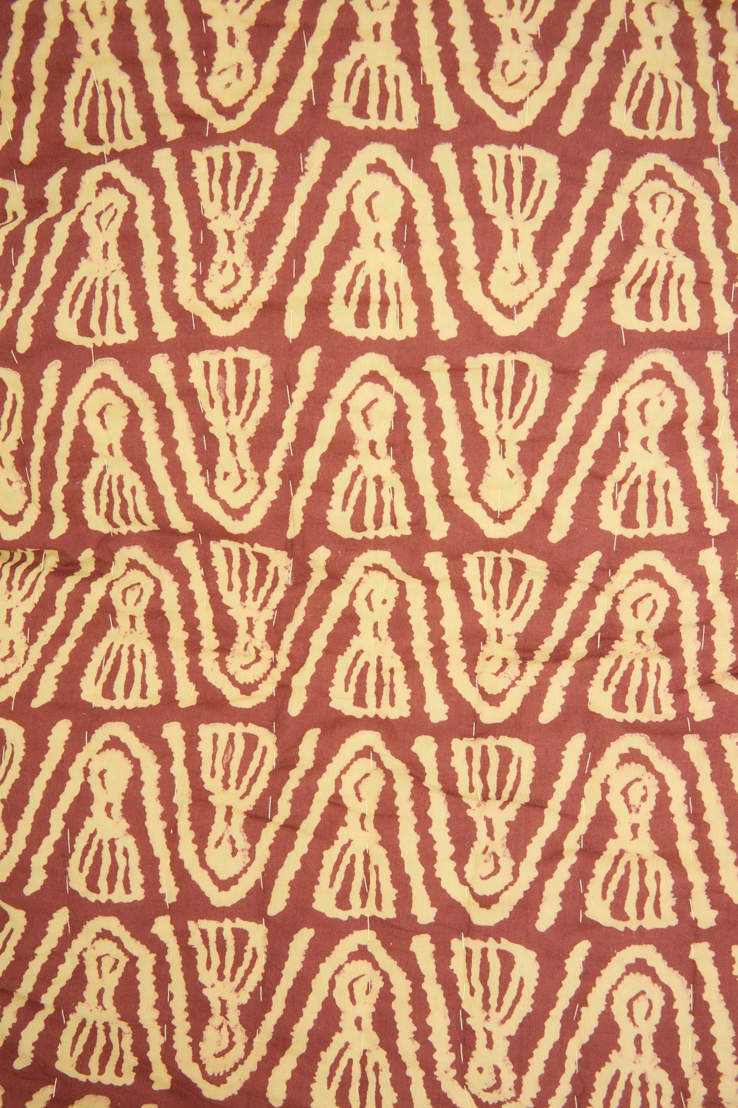 The Wild Shroom Quilt 100 x 108" by Studio Ford features cream geometric shapes on a reddish-brown block-printed percale cotton background, offering an artisanal, unique design.