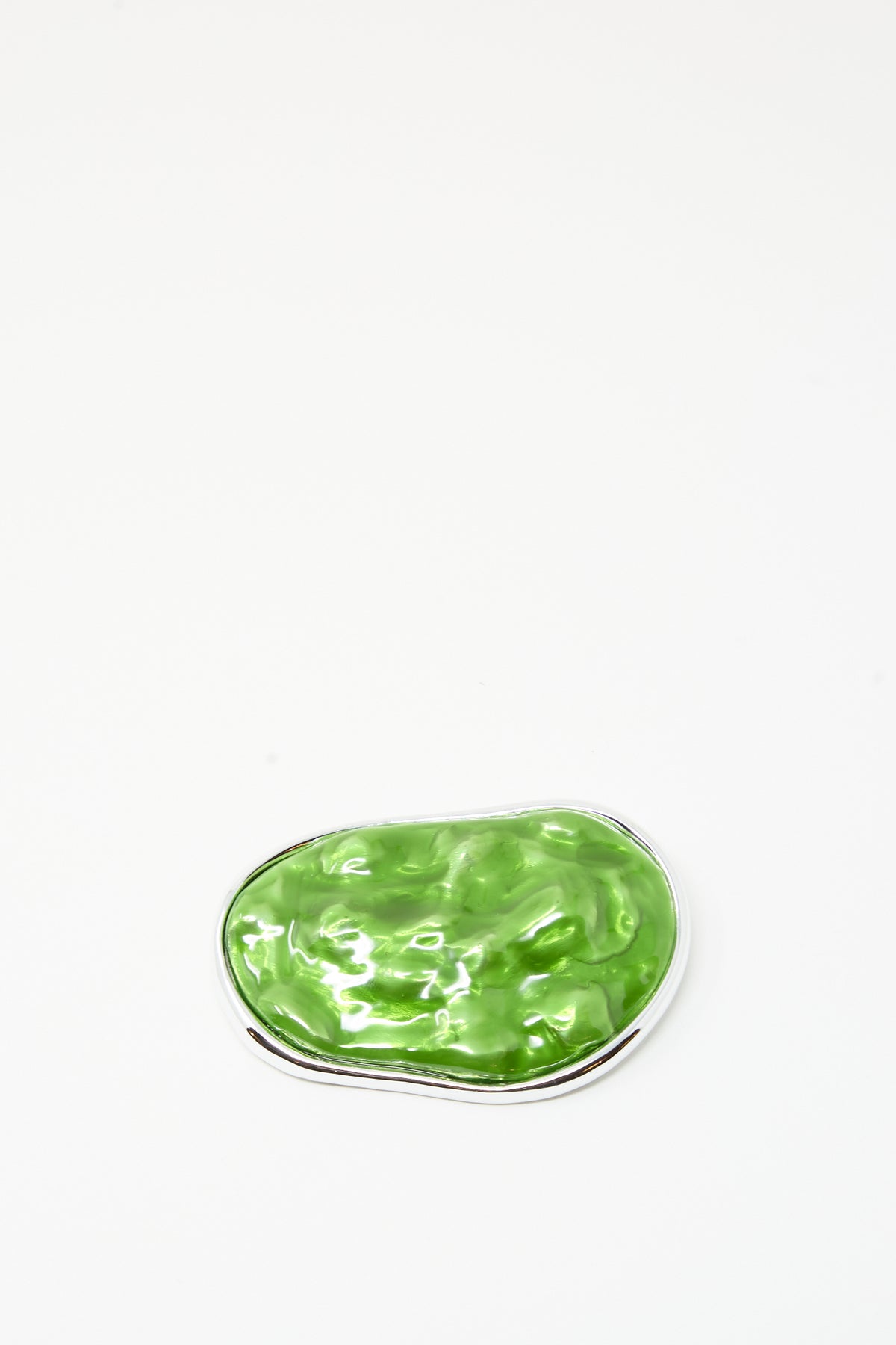 The TOGA ARCHIVES Round Wave Brooch in Light Green, featuring a glossy green surface edged with silver-tone brass, is displayed against a plain white background.