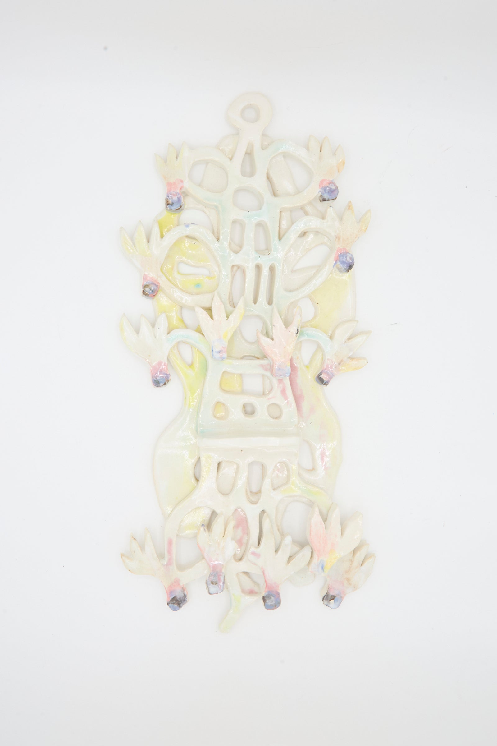 The Cyclamens Wall Piece by Tamar Mogendorff is a handmade ceramic art sculpture with abstract shapes, bird-like forms, pastel accents, and purple details—offering unique Brooklyn-made decor.