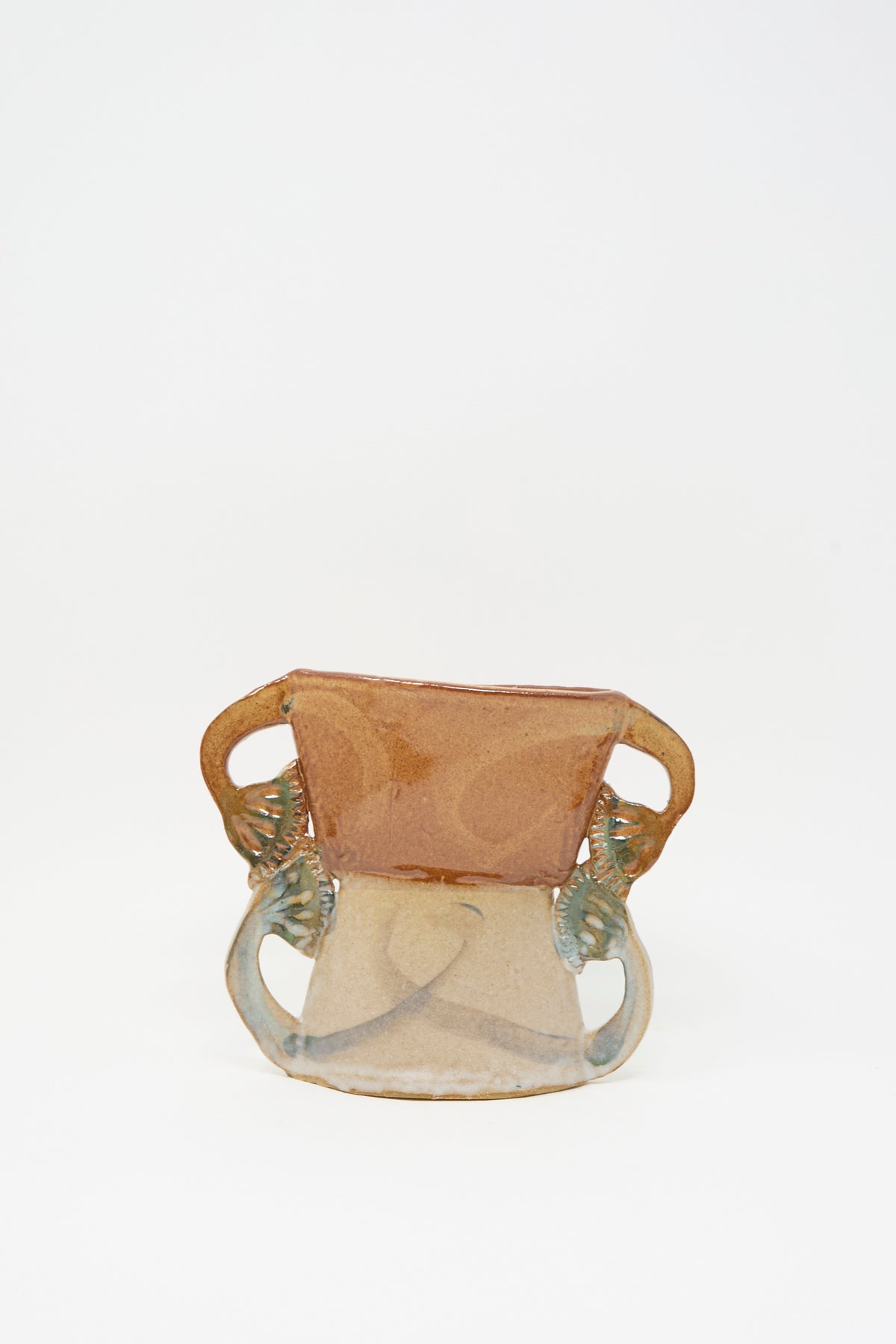 Tamar Mogendorff’s Four Papyrus Vase, a two-toned ceramic vase with four small handles.