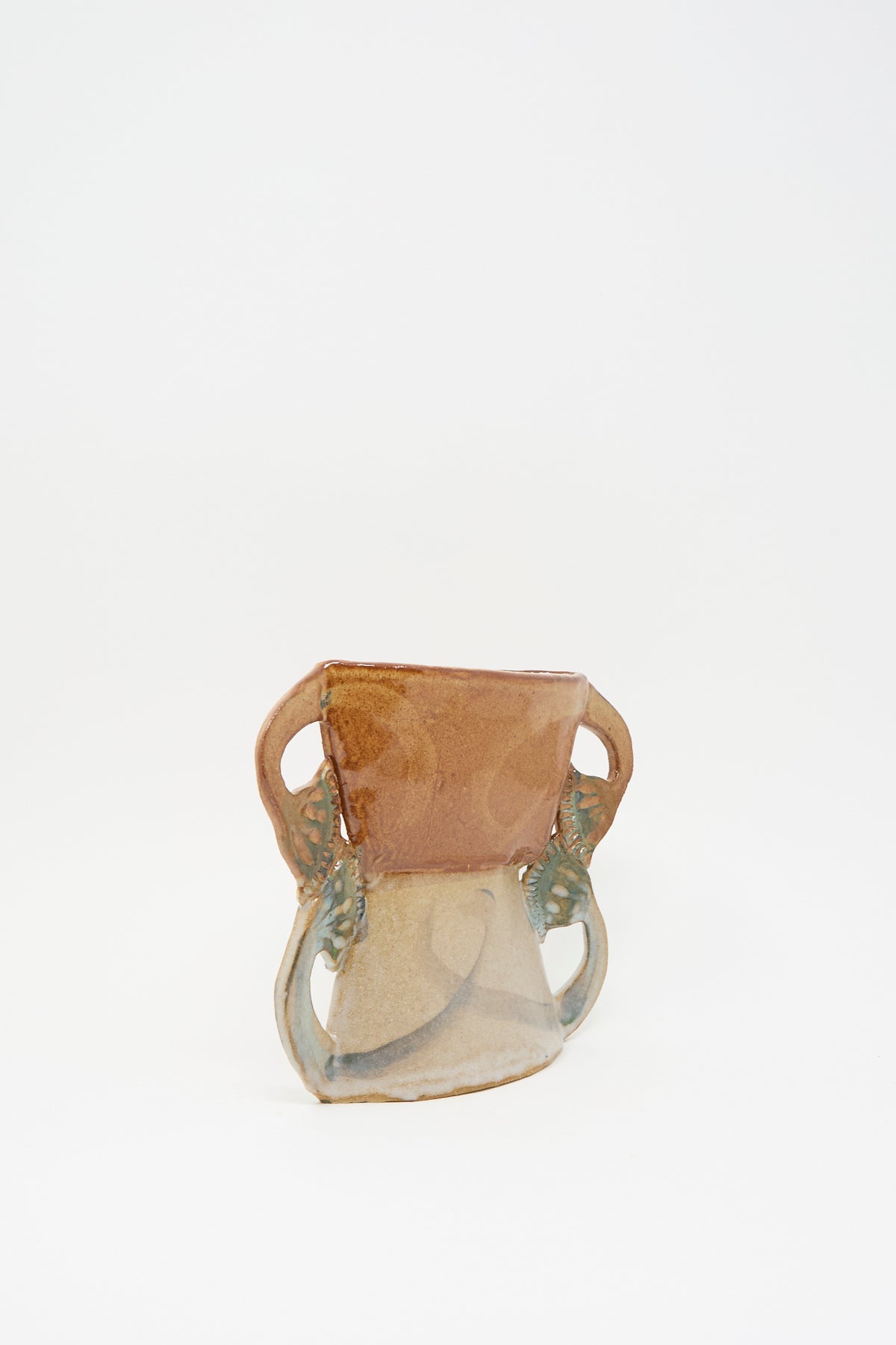 Tamar Mogendorff’s Four Papyrus Vase, a two-toned ceramic vase with four small handles.