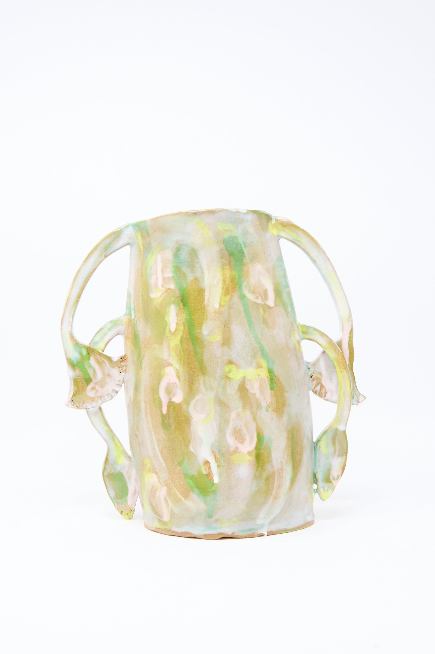 Handmade in Brooklyn, the Papyrus Bloom Vase by Tamar Mogendorff features a glossy green and beige marbled ceramic finish with four outward-curving floral handles.