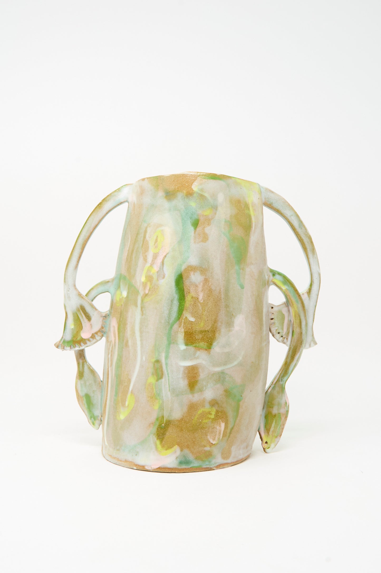 Papyrus Bloom Vase by Tamar Mogendorff—a tall, handcrafted ceramic vase with a glossy, mottled green and beige finish, highlighted by two organically curved floral handles on each side; a striking piece from Brooklyn.