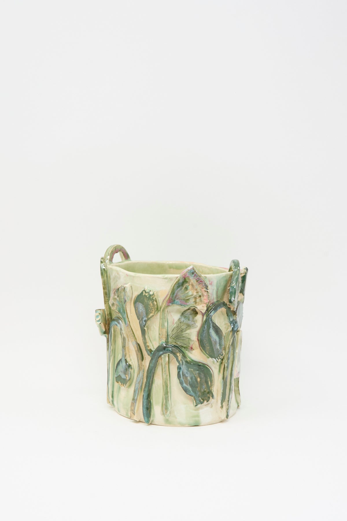 Tamar Mogendorff Papyrus Flowers Vase in Green: a cylindrical green ceramic vase with embossed floral motifs.