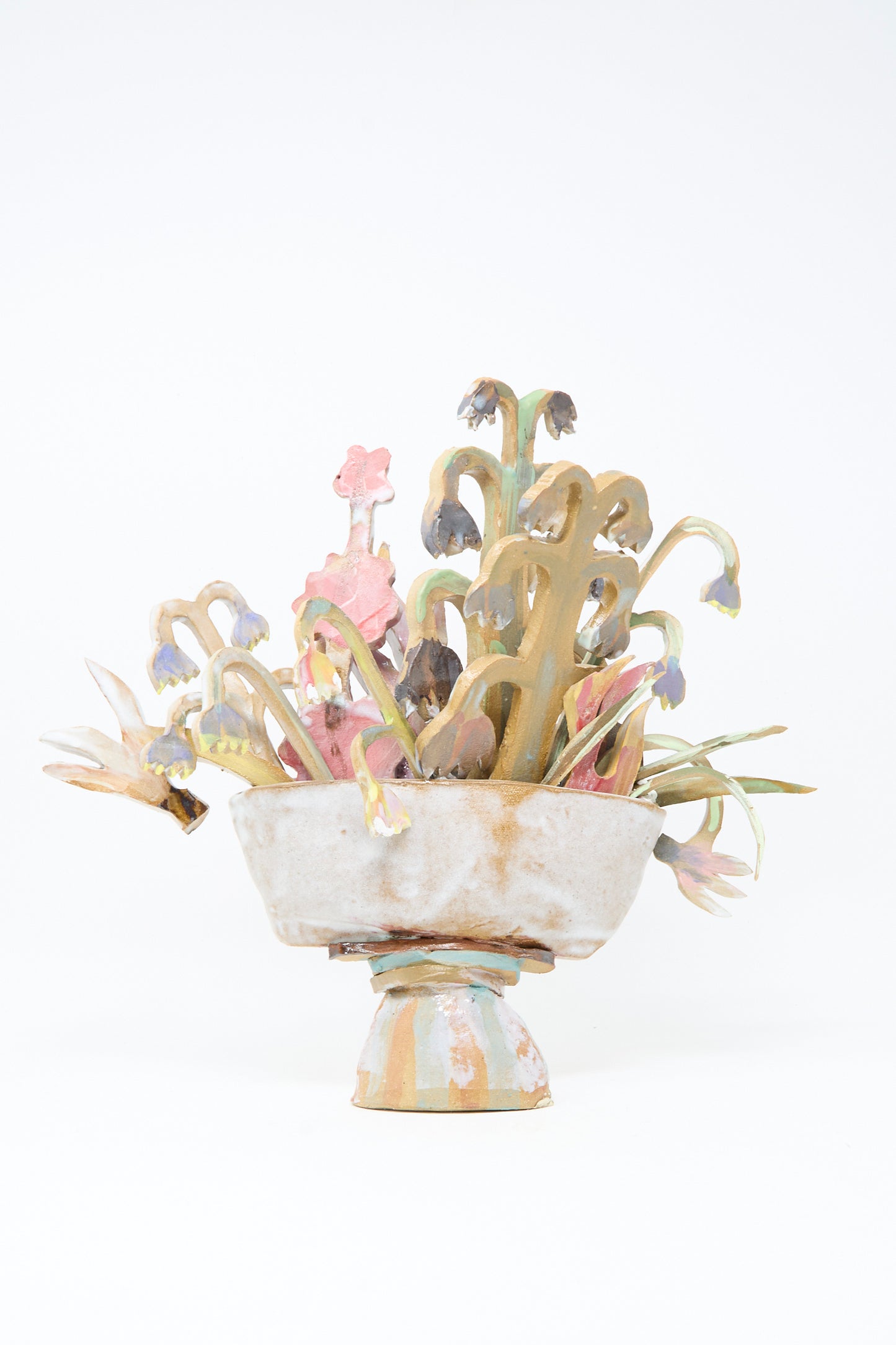 The Spring Flower Arrangement by Tamar Mogendorff is a handmade Brooklyn ceramic sculpture with a pedestal bowl and abstract pastel ceramic flowers—an eye-catching, unique floral home decor piece.