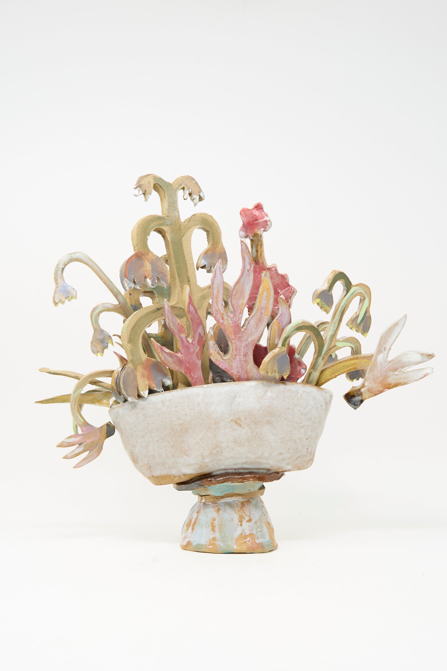 Spring Flower Arrangement by Tamar Mogendorff features an abstract, stylized ceramic plant sculpture, handmade in Brooklyn, displayed in a rough white bowl with a small pedestal base, set against a plain white background.