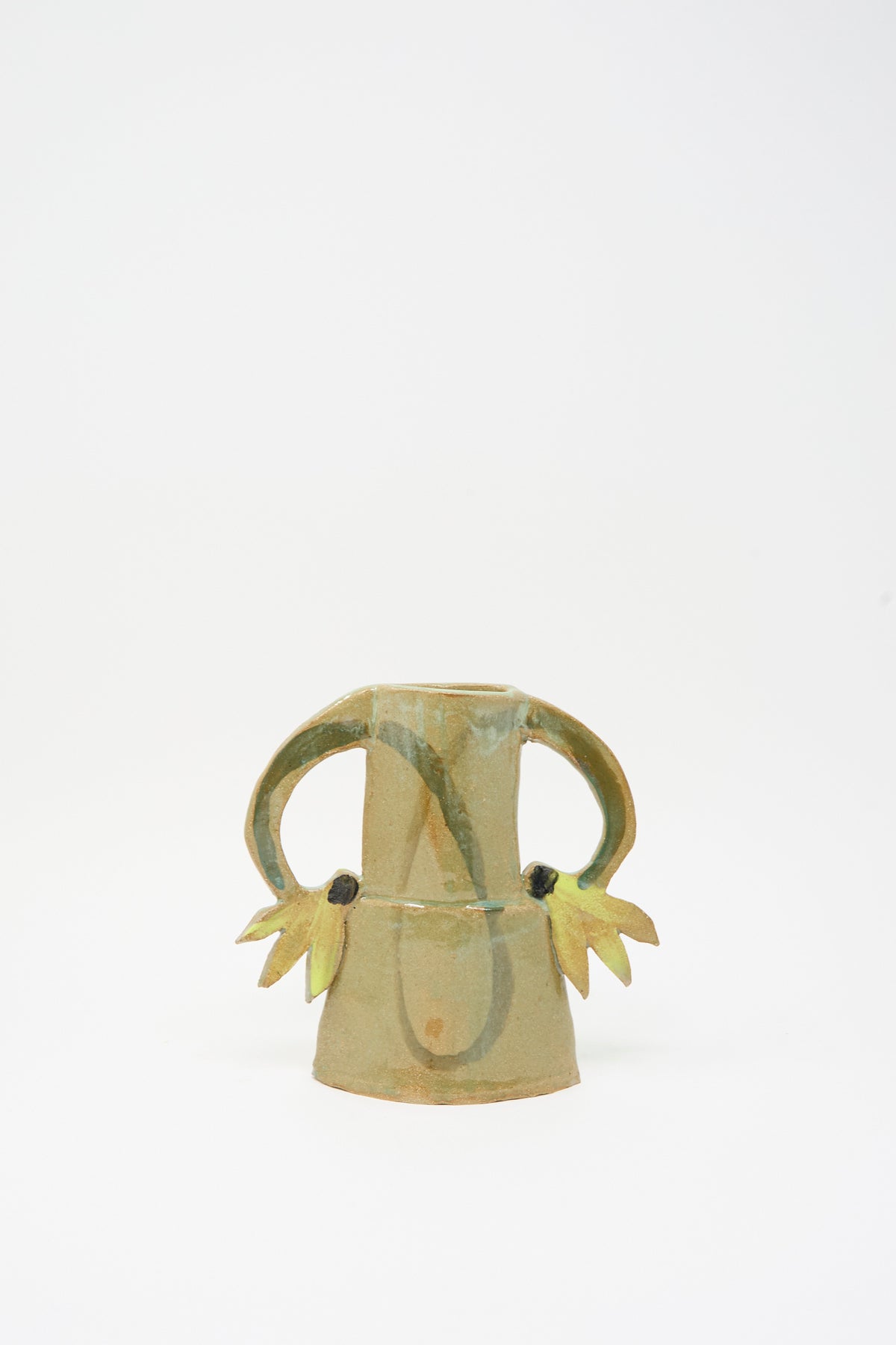 Two Cyclamens Vase in Celadon Green II: a handmade ceramic vase in a muted celadon green glaze with two looped handles adorned with small yellow, petal-like accents.