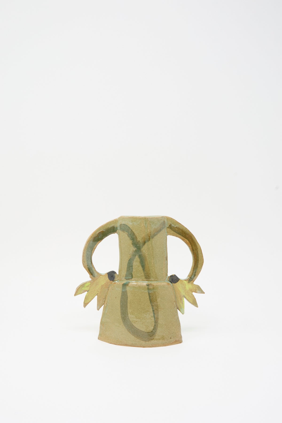Tamar Mogendorff Two Cyclamens Vase in Celadon Green II, a handmade ceramic vase with two arched handles and decorative leaf-shaped accents.