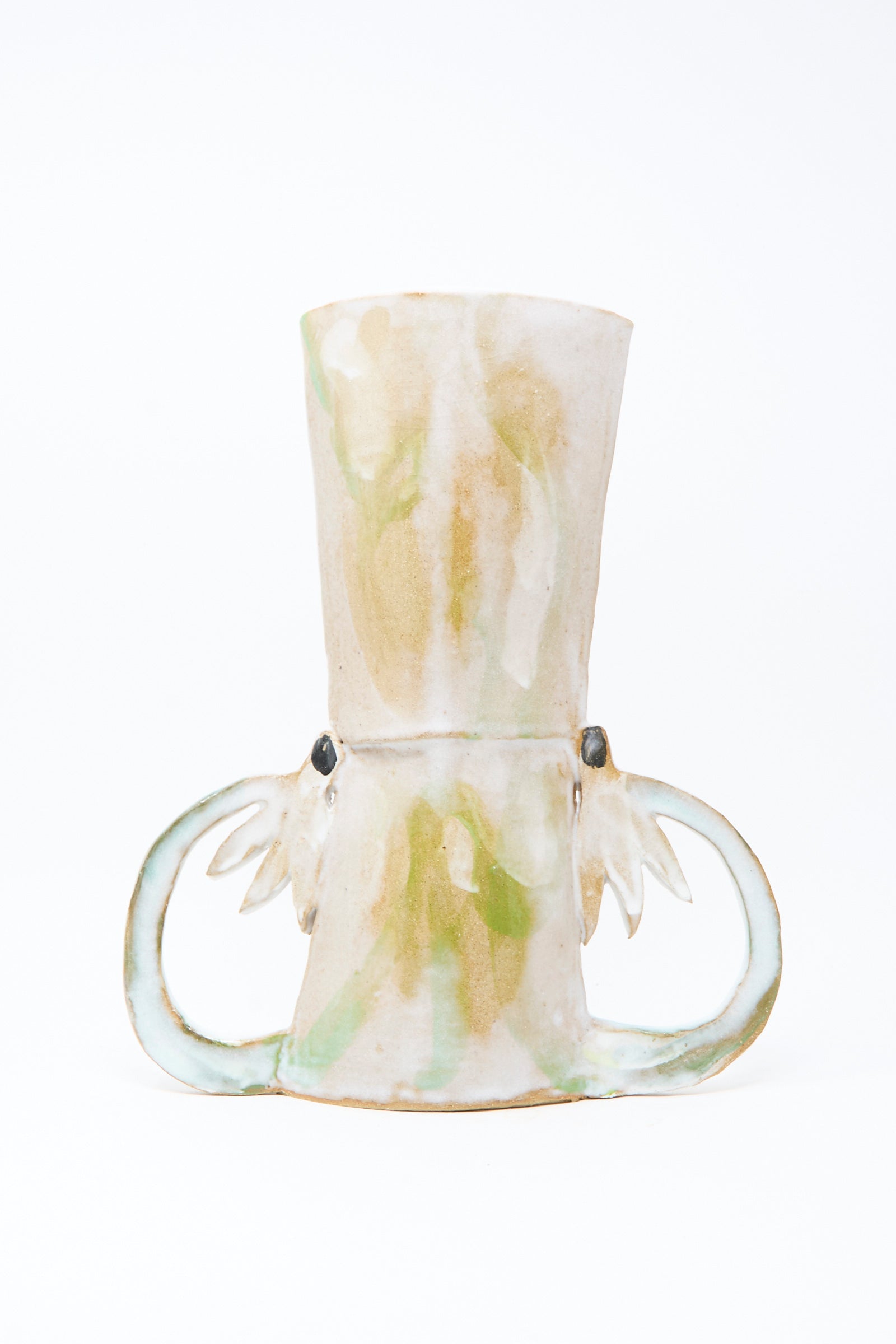 The Two Cyclamens by the Lake Vase by Tamar Mogendorff is a handmade, tall cylindrical vase with two large side handles and a mottled beige, green, and white glaze, crafted in Brooklyn and photographed on a plain white background.