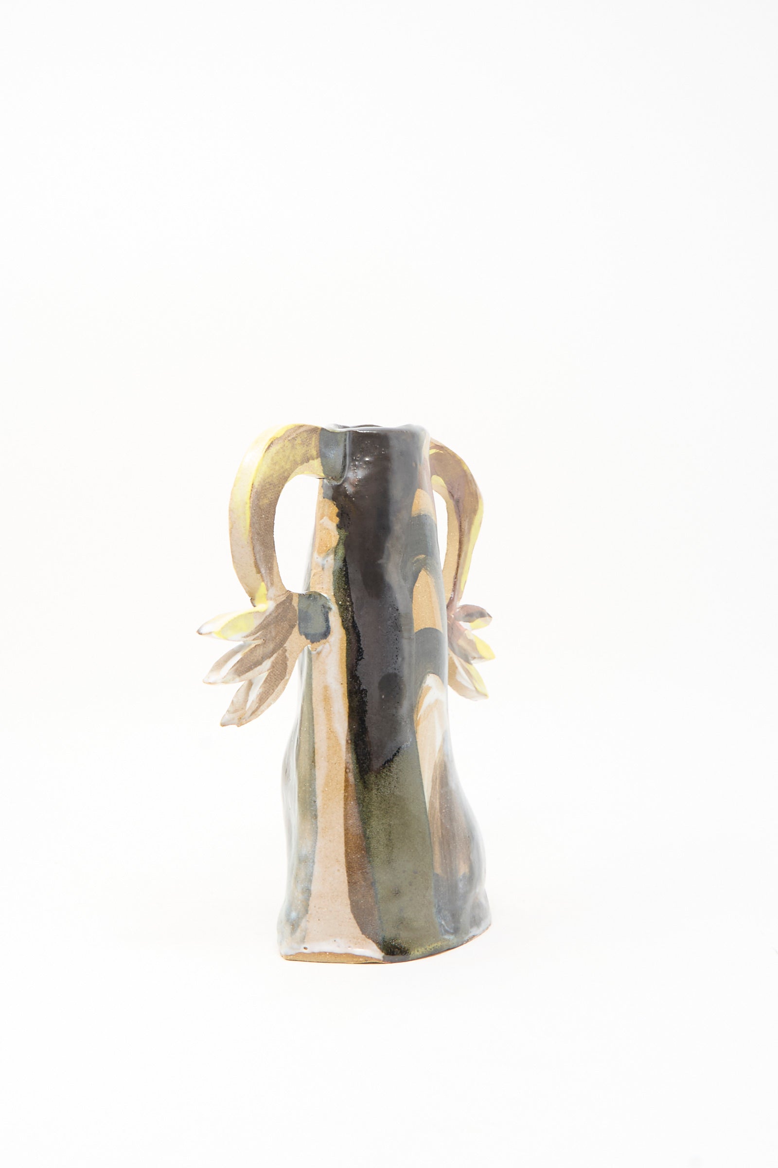 The Two Cyclamens on Top of a Mountain Vase by Tamar Mogendorff is a handmade ceramic piece with an abstract shape, earth-toned glaze, and two curved, flower-detailed handles—crafted in Brooklyn for unique style.