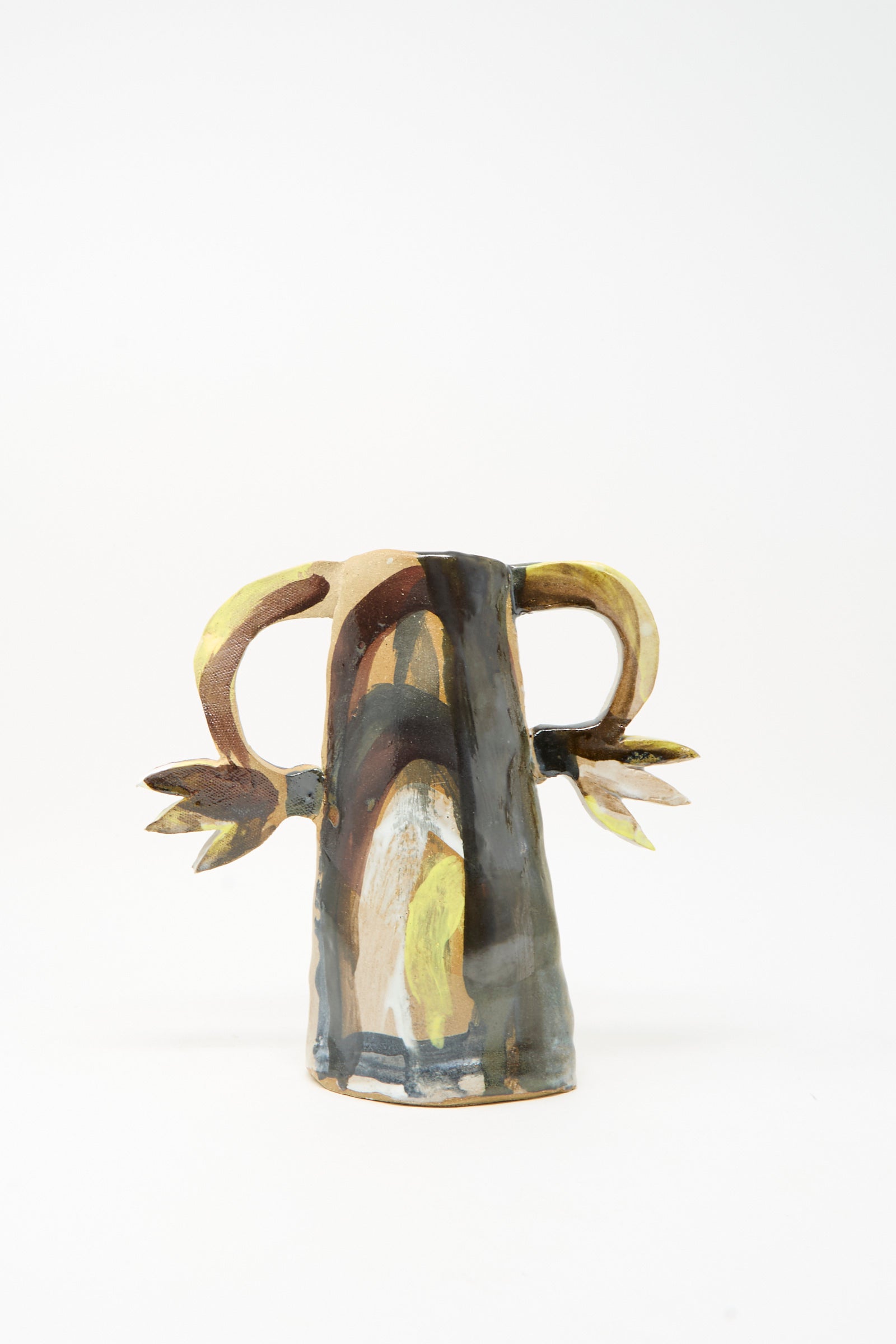 Handmade in Brooklyn by Tamar Mogendorff, the Two Cyclamens on Top of a Mountain Vase features two side handles shaped like horns and leaves, adorned with an abstract, multicolored painted design. The artisan ceramic vase is photographed against a plain white background.