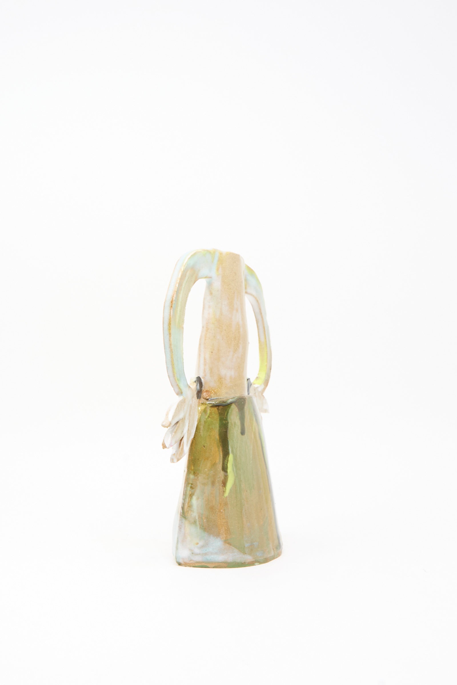 The Two Cyclamens on Top of a Mountain Vase III by Tamar Mogendorff is a handmade Brooklyn ceramic vase featuring a conical base, elongated looped handles, and muted earth tones, shown against a plain white background.