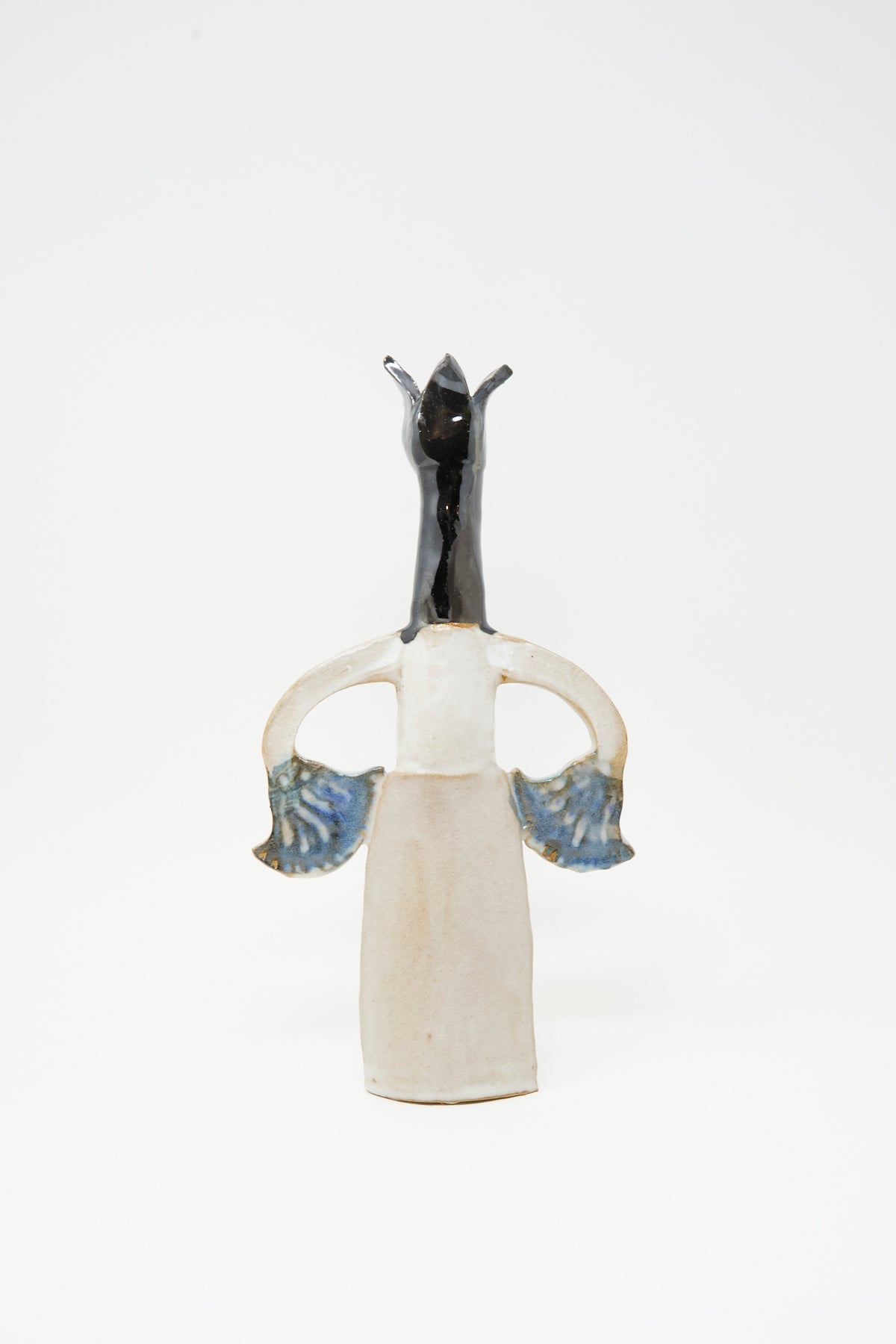 Tamar Mogendorff Two Papyrus Candle Holder, a handmade ceramic piece shaped like an abstract figure with a long dark neck and blue-accented flared arms in a multicolored glaze.