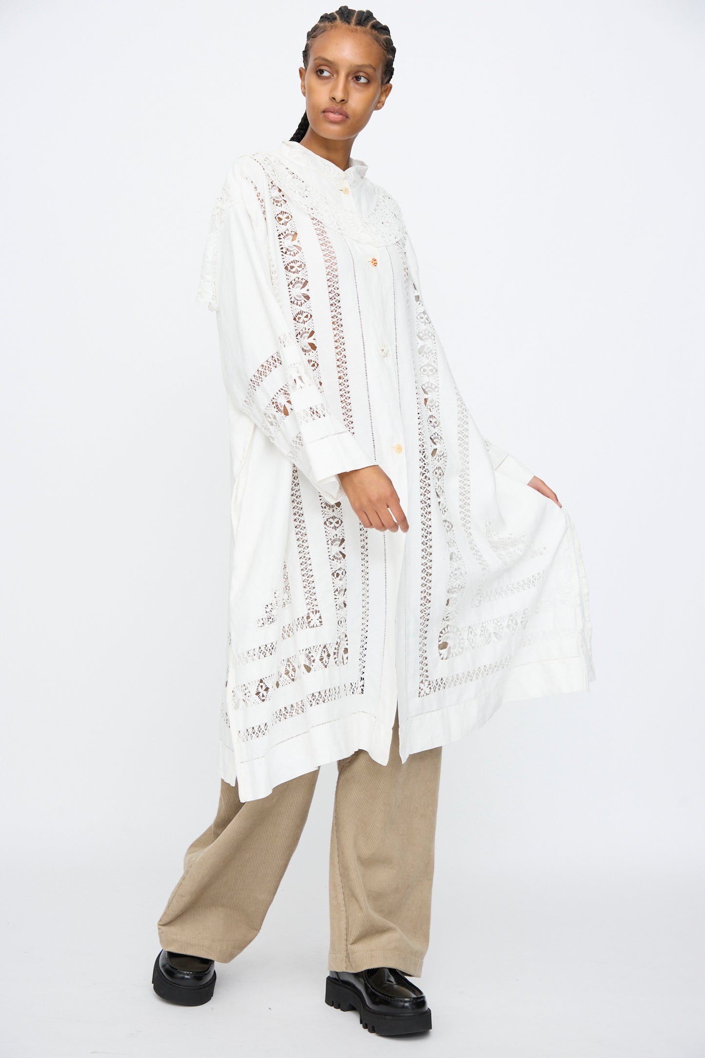 A person wearing the Thank You Have A Good Day Ruffle Oversized Oxford shirt over beige pants and black shoes, standing against a plain white background.