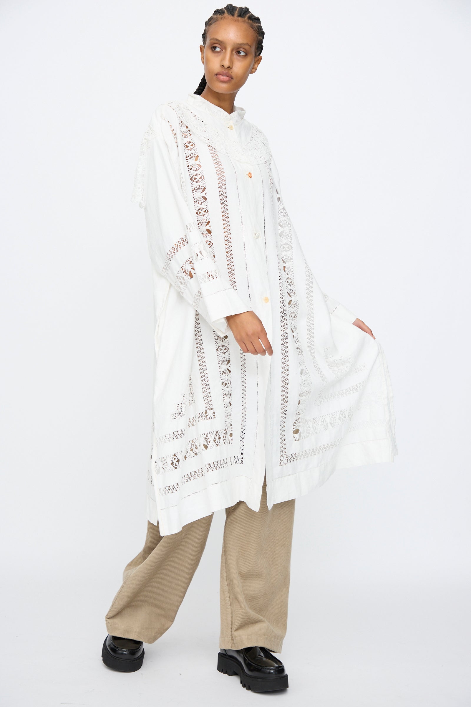 A person wearing the Thank You Have A Good Day Ruffle Oversized Oxford shirt over beige pants and black shoes, standing against a plain white background.