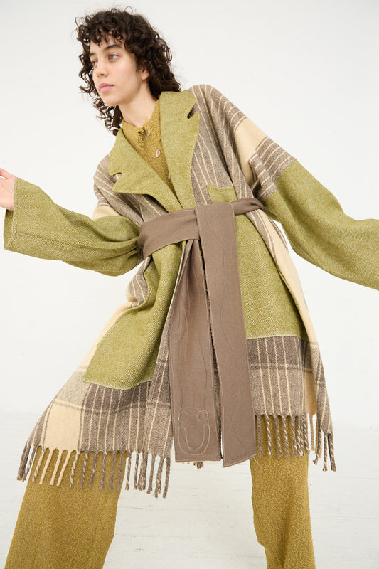 A woman wearing a Thank You Have A Good Day Houston Belted Soft Fringe Coat with fringe.