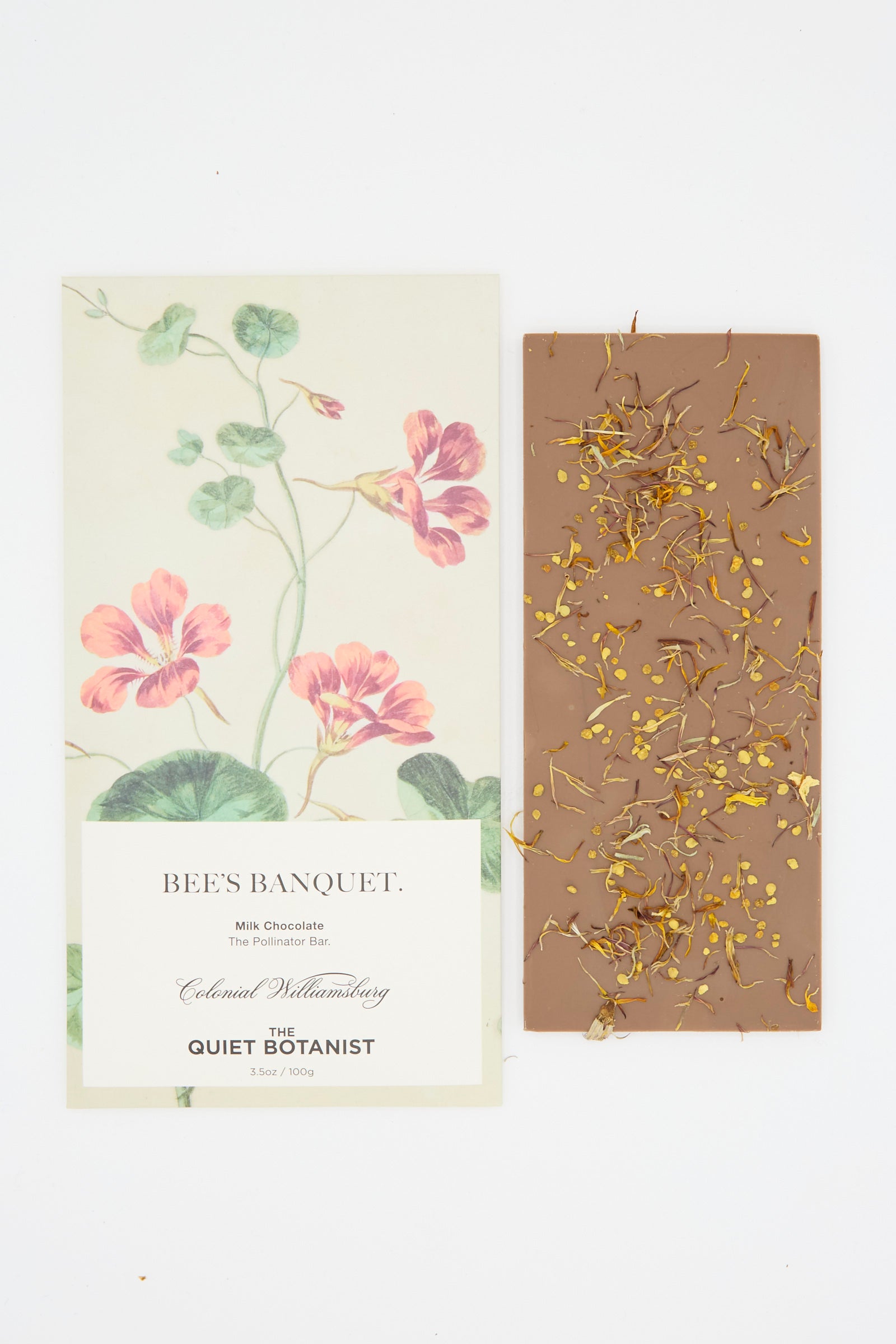 The Bee's Banquet Bar, by The Quiet Botanist, is a milk chocolate bar embellished with bee pollen and flower petals, packaged with botanical illustrations.