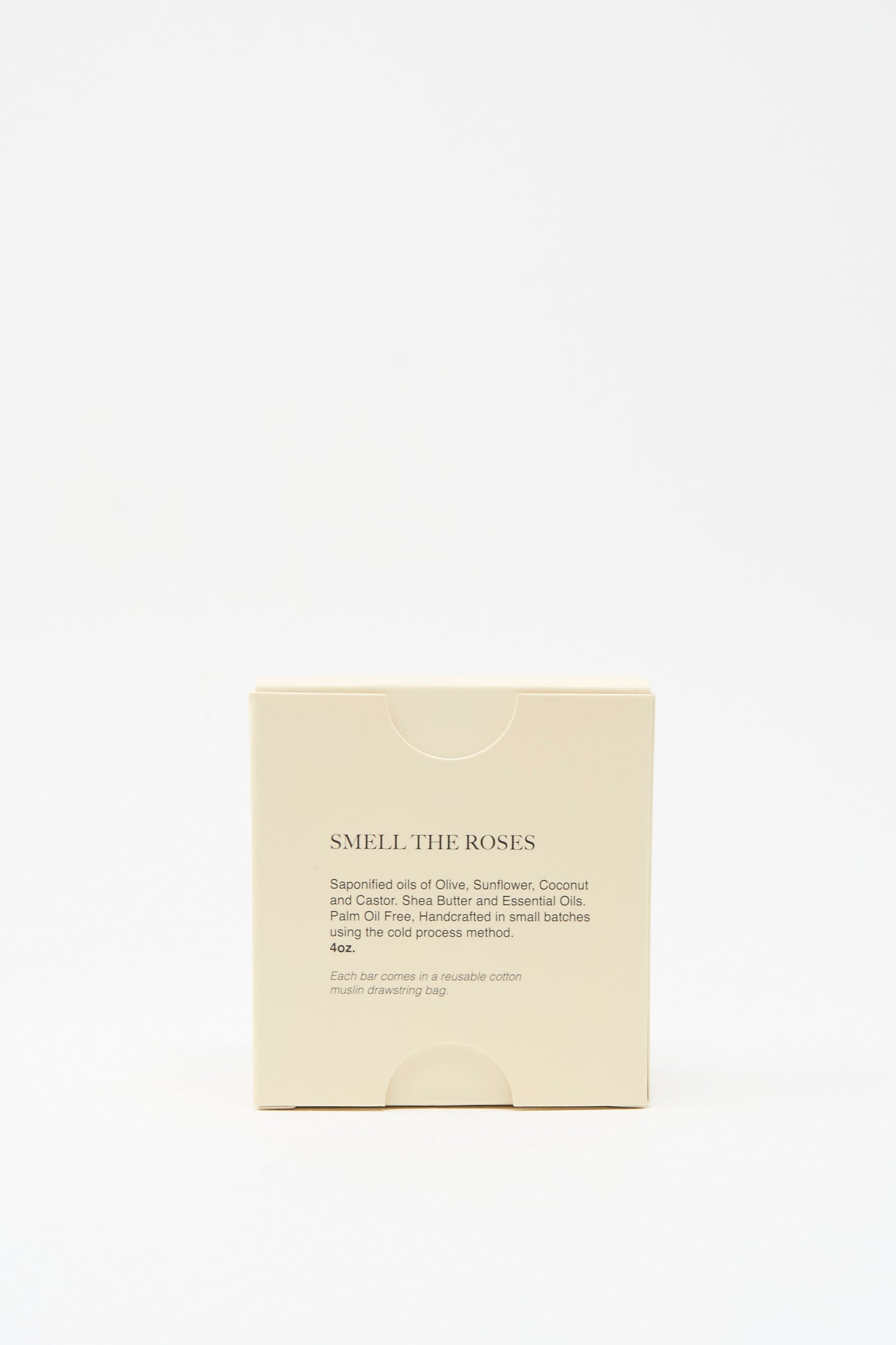 A beige box labeled "Smell The Roses Soap Bar" by The Quiet Botanist, showing product details and ingredients on the front, contains a vegan rose bar soap handmade in Turkey, set against a plain white background.