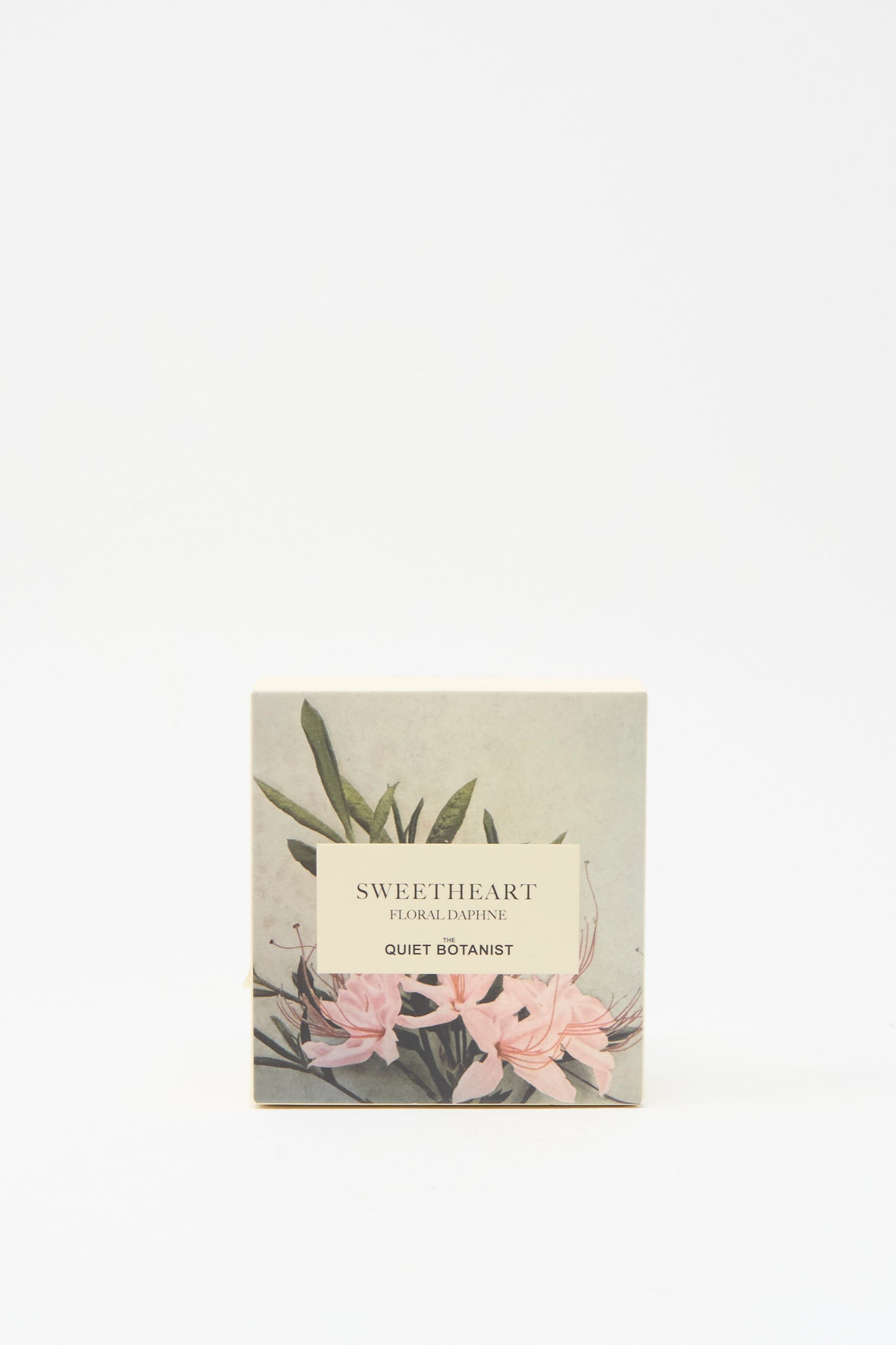 A square box labeled "Sweetheart Floral Daphne Soap Bar" by The Quiet Botanist, adorned with floral and leaf illustrations on a light background, featuring handmade sensitive-skin soap crafted in Turkey.
