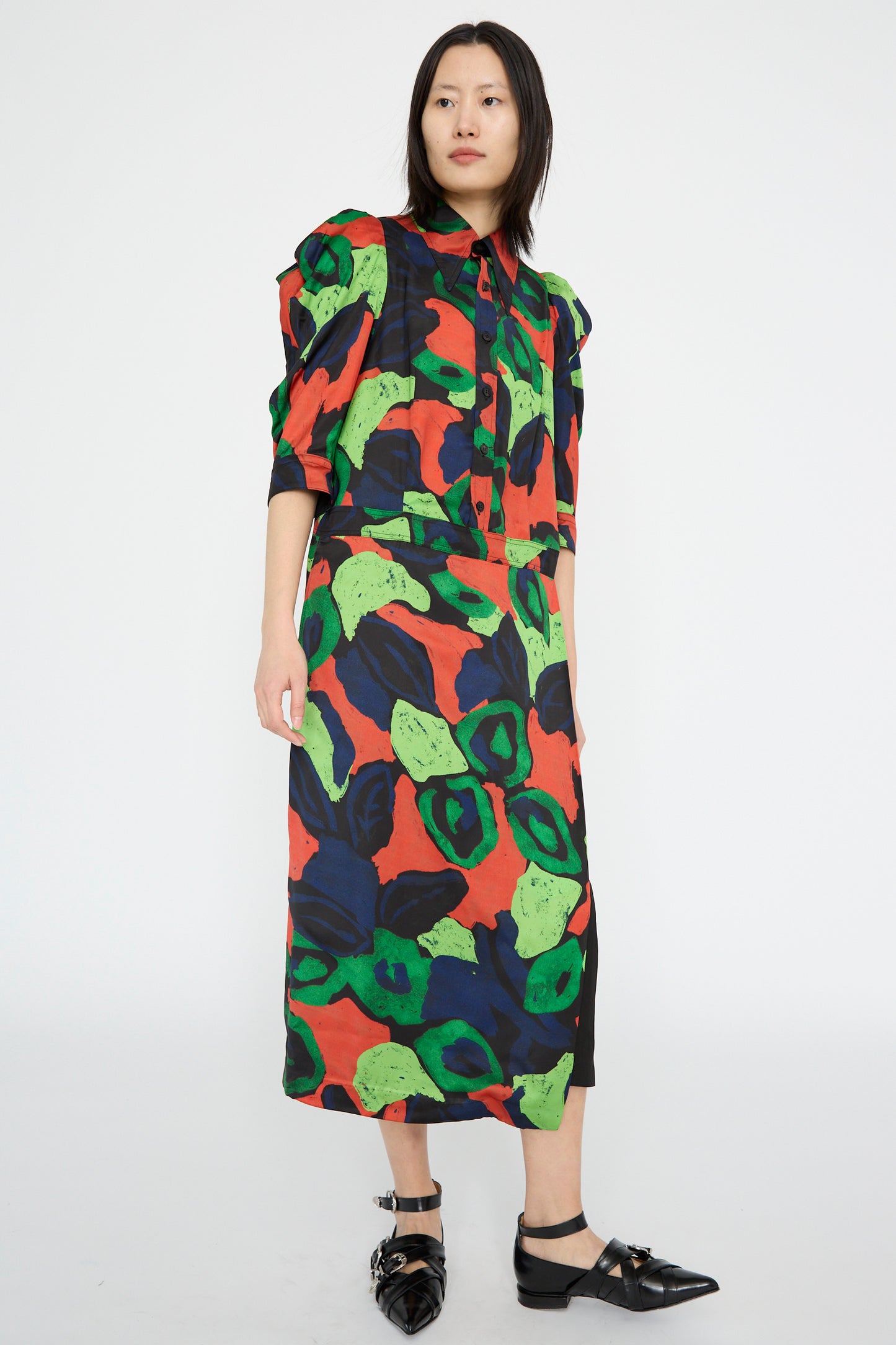 Someone is wearing the Satin Print Dress in Mix by TOGA ARCHIVES with black shoes, standing against a plain background.