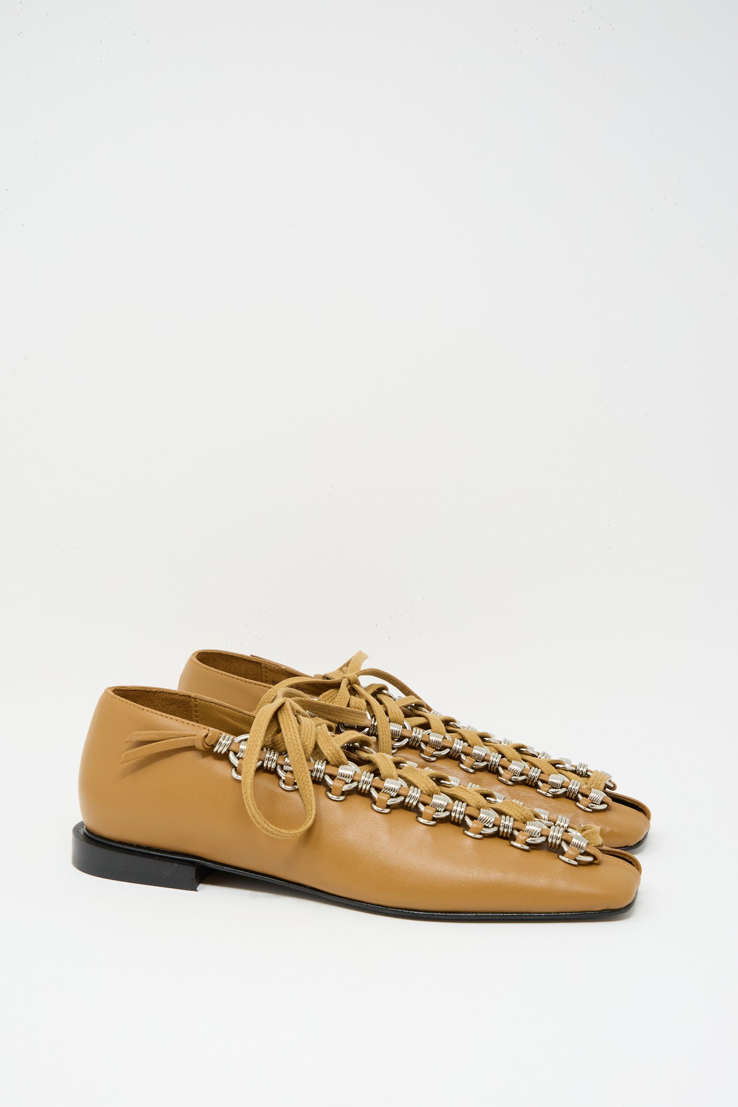 The TOGA ARCHIVES Soft Leather Shoe in Tan features cowhide leather, lace-up closure, silver bead accents, and a split toe design. Made in Portugal, it's shown against a plain white background.