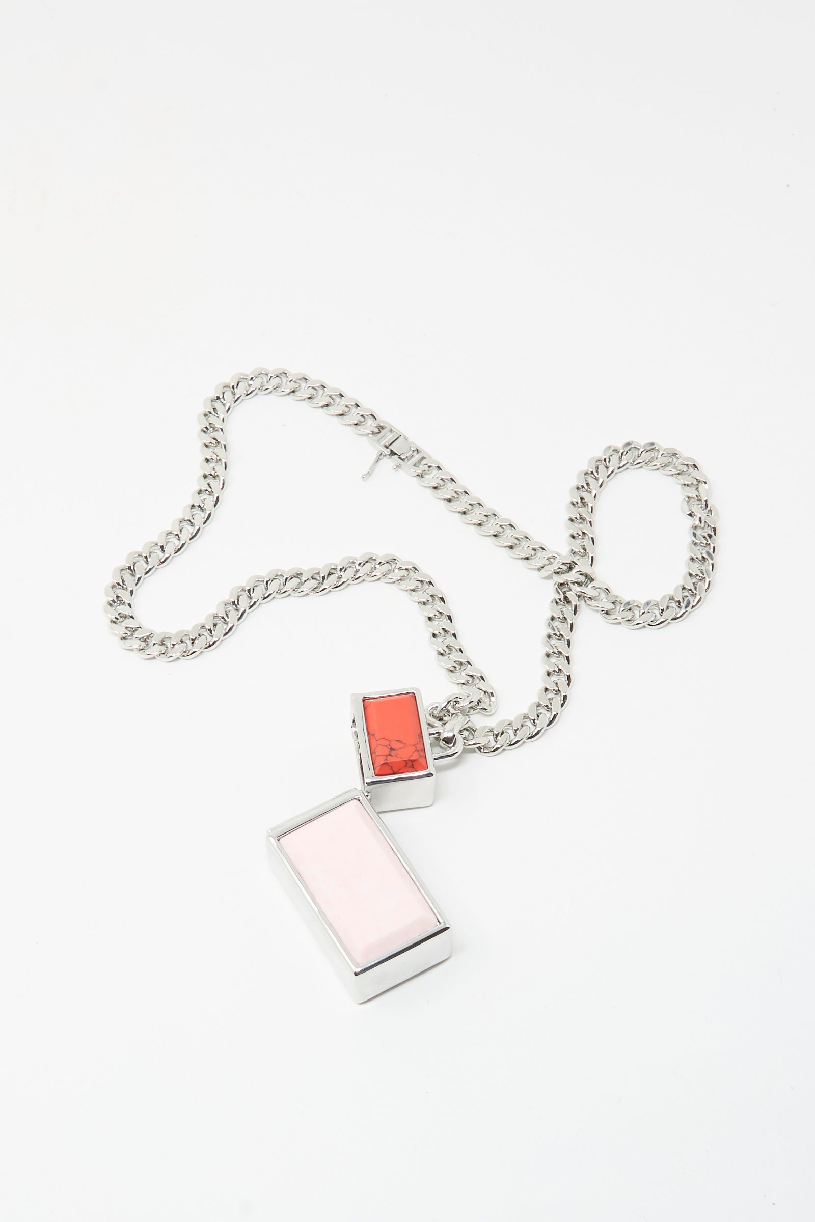 The TOGA ARCHIVES Pill Case Necklace in Light Pink features two rectangular pendants, one pink and one red, on a silver chain. Made in Japan and displayed against a white background.