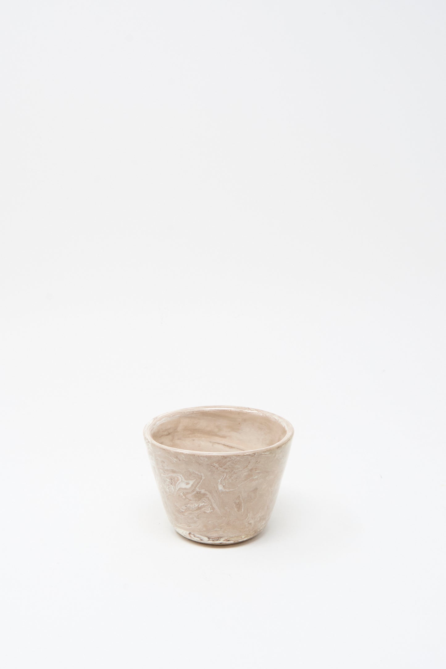 The Totem Home Ceramic Olive Bowl is a small, handmade beige bowl featuring a subtle marbleized glaze, shown on a plain white background.