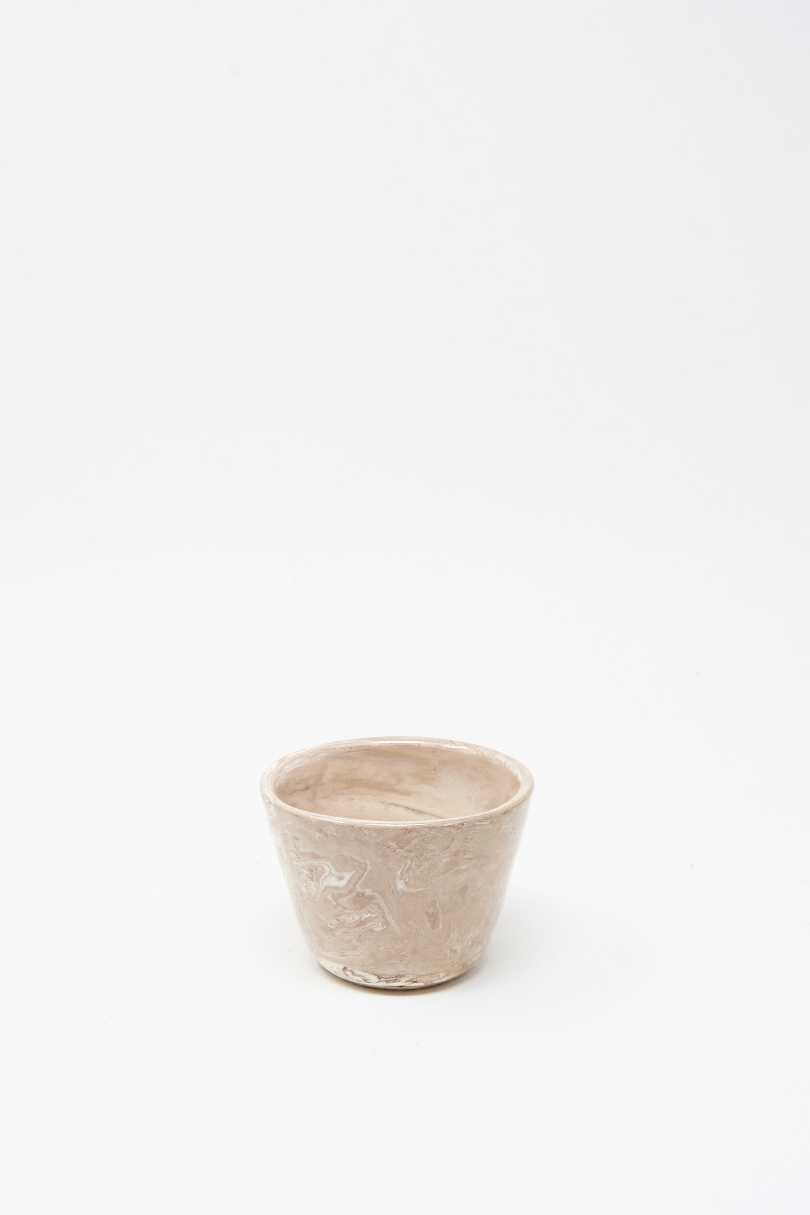 The Totem Home Ceramic Olive Bowl is a small, handmade beige bowl featuring a subtle marbleized glaze, shown on a plain white background.