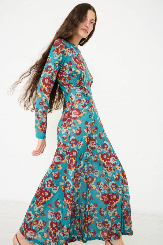 Person wearing a long, flowy Ceryse Dress in Jade Floral by Ulla Johnson, standing against a plain white background.