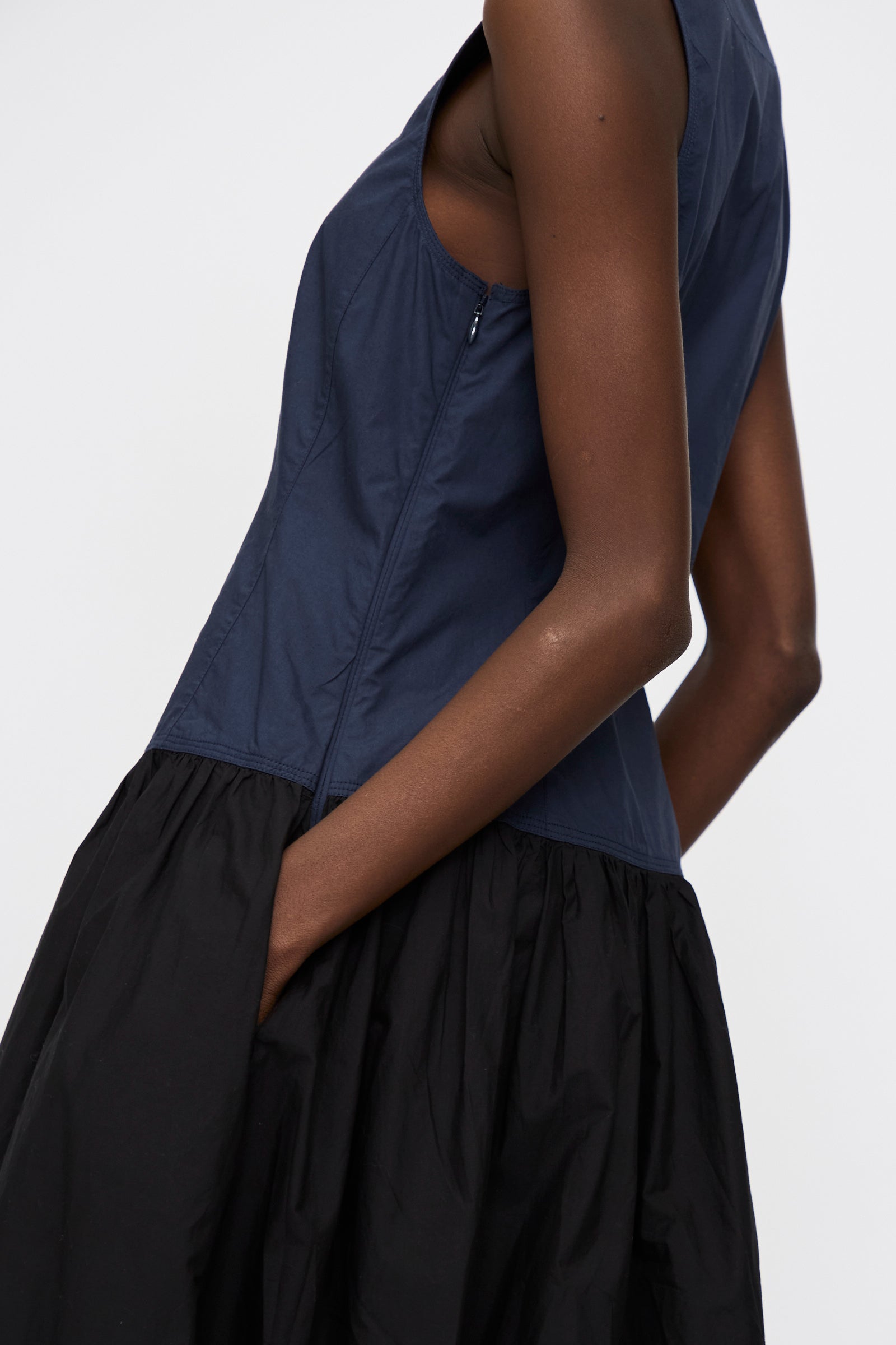 A person wearing the Ulla Johnson Water Washed Poplin Denia Dress in Twilight Colorblock stands against a plain light background.