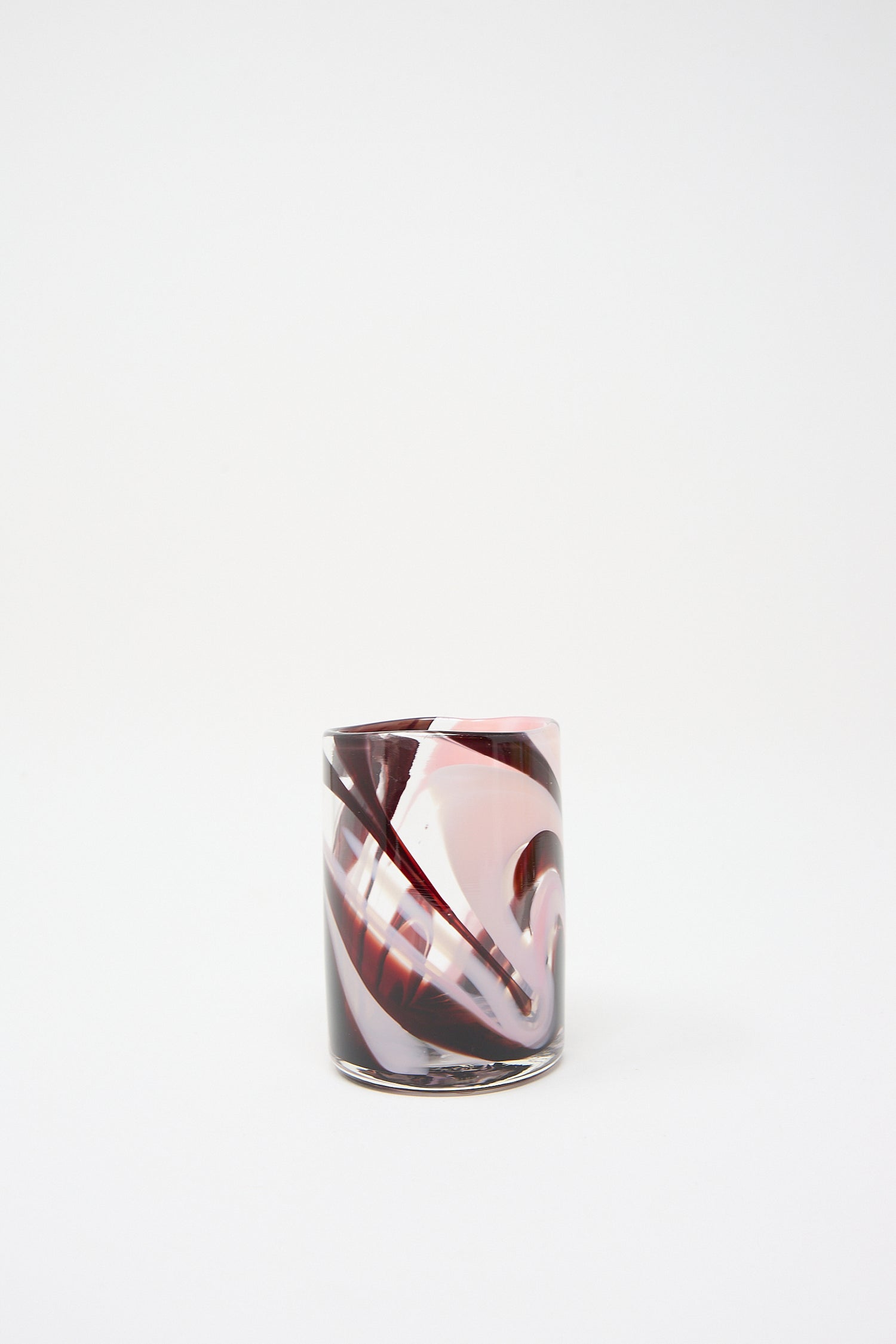 Clear hand blown glass with a swirl of pink and gray colors on a white background, crafted by artisans in NYC. - Upstate's Gamay Cup