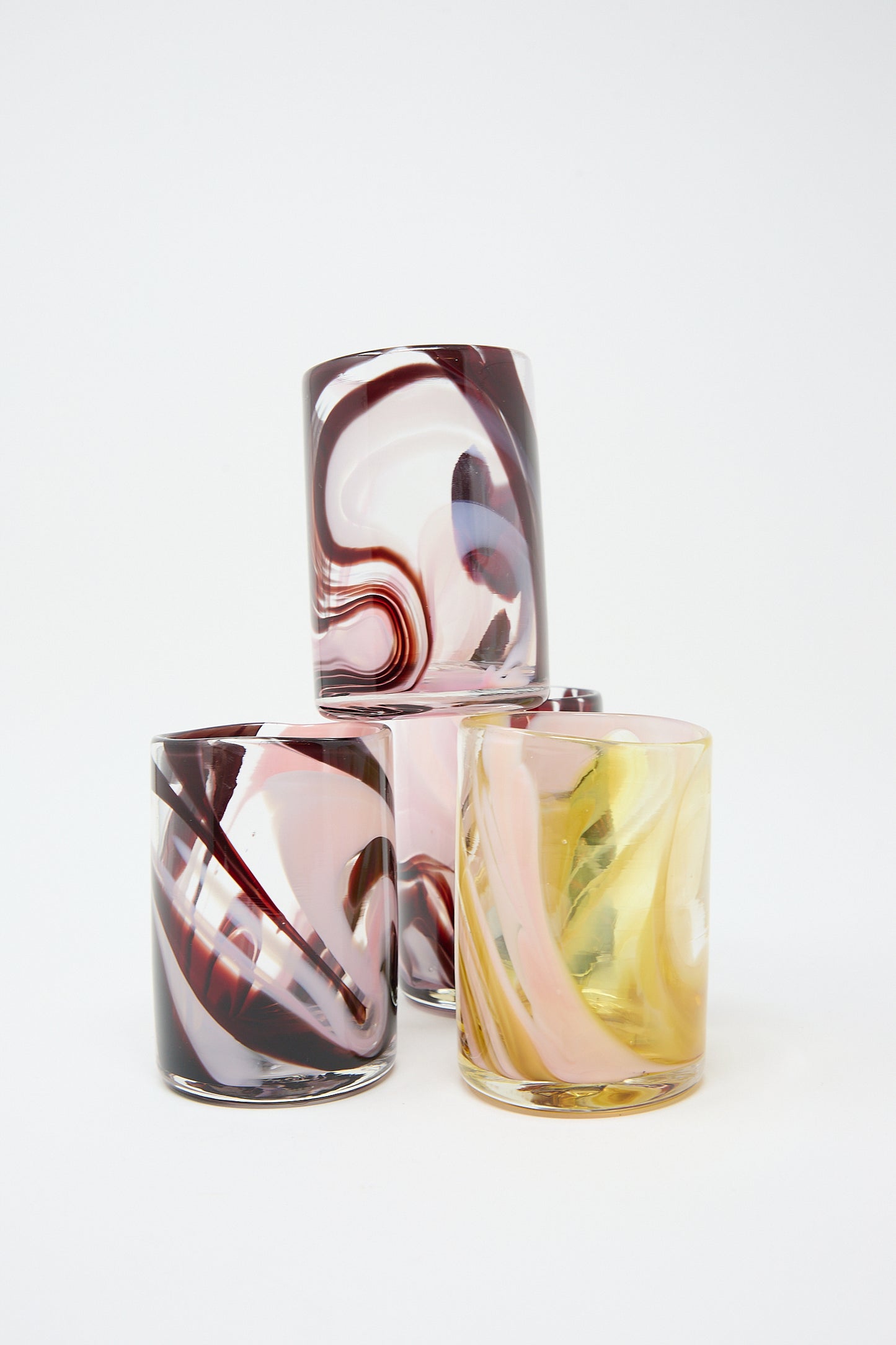 Three Upstate Gamay Cups with swirl designs and unique abstract color on a white background, crafted by artisans in NYC.
