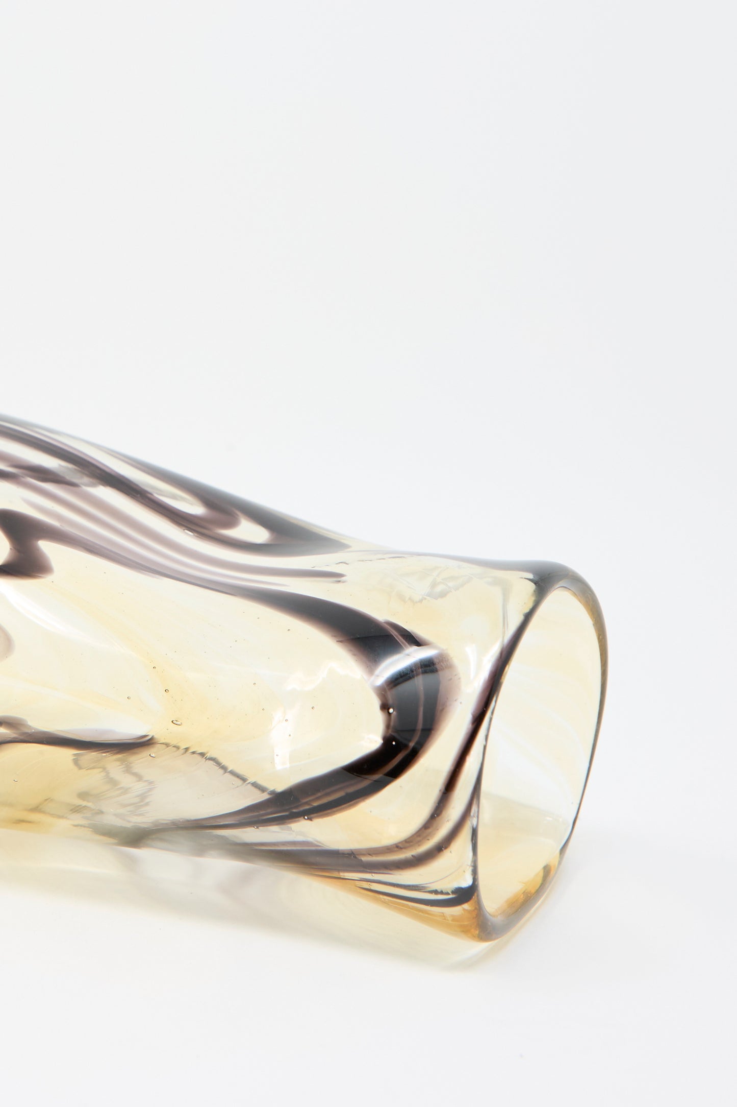 A close-up of the Hand Blown Fumé Carafe in Smoke and Tobacco by Upstate, showcasing its wavy, marbled brown and beige pattern against a plain white background.