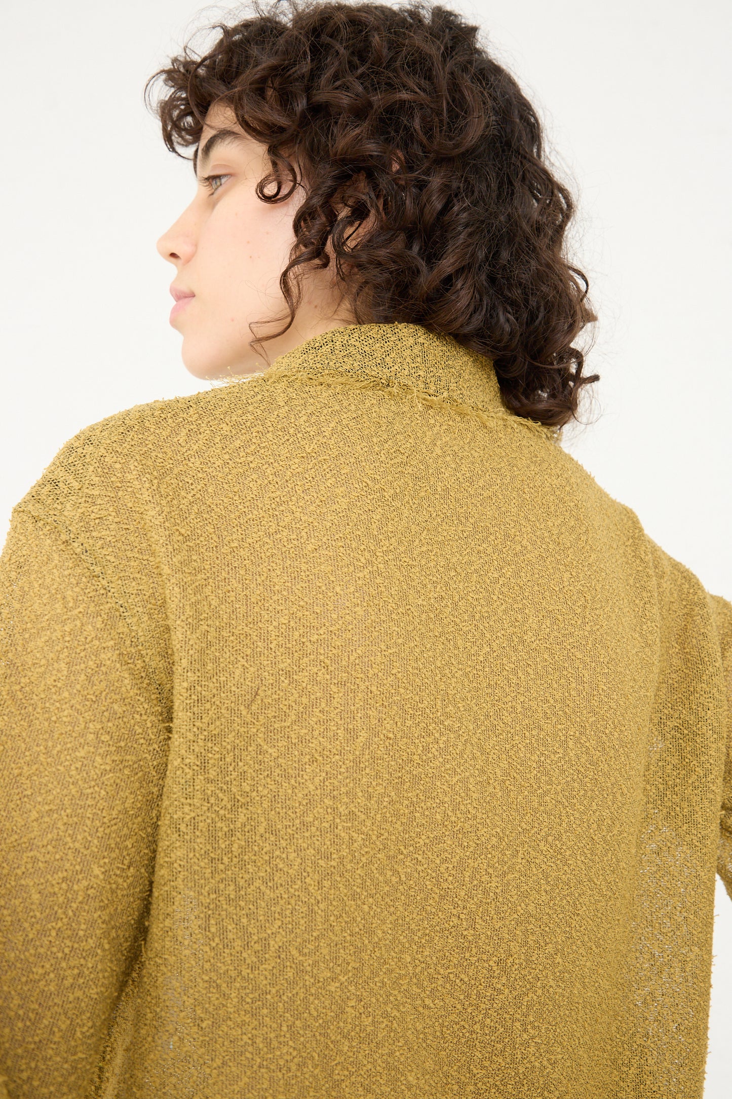 The back view of a woman wearing a Tweed Blouse in Cumin by Veronique Leroy.