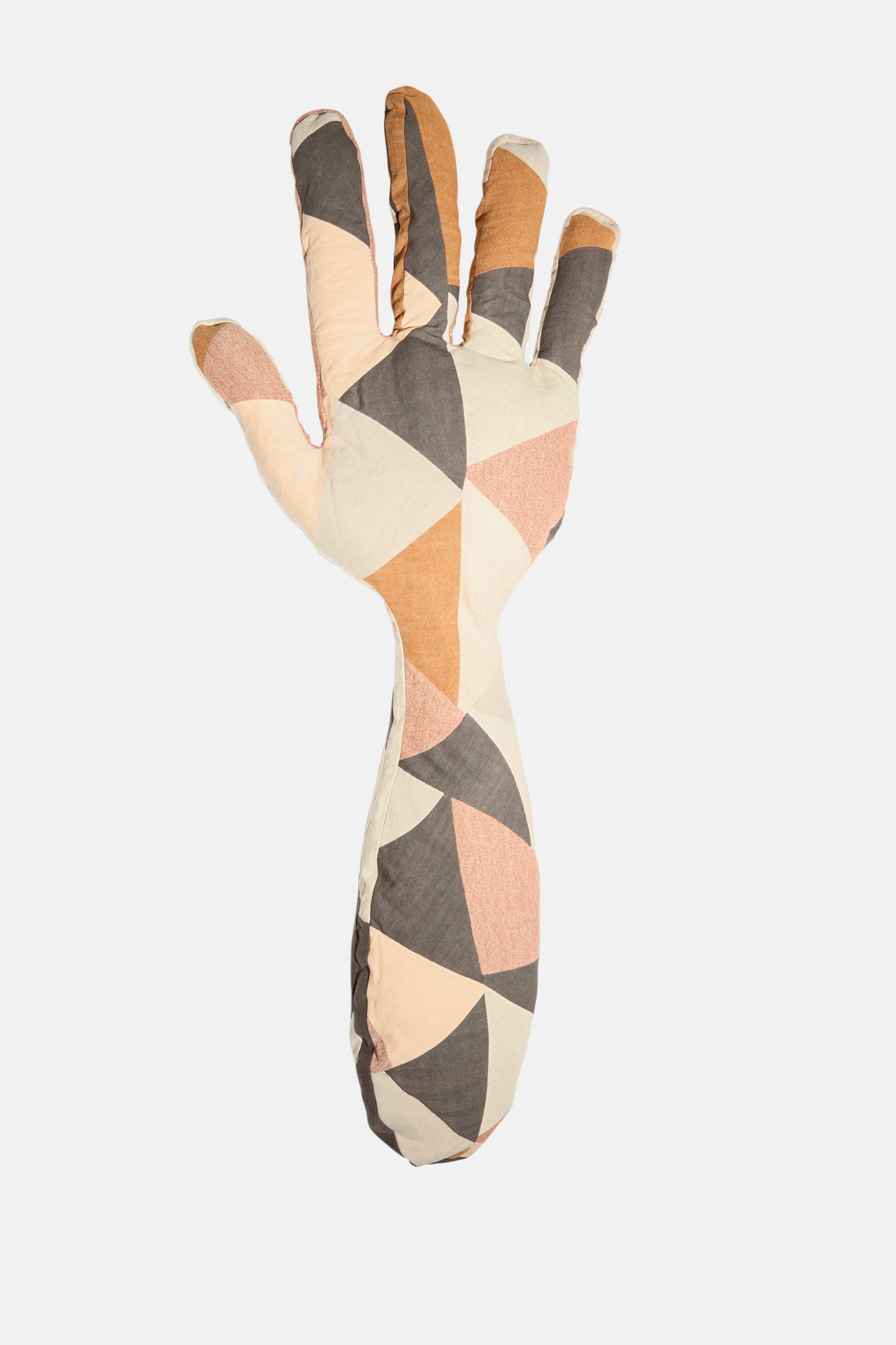 The Sonia Delaunay Tissu Simultané Giant Hand Bolster I by Wiener Times is an Austrian-made, hand-shaped pillow featuring a geometric pattern in beige, peach, brown, and gray triangles inspired by Wiener Werkstätte.