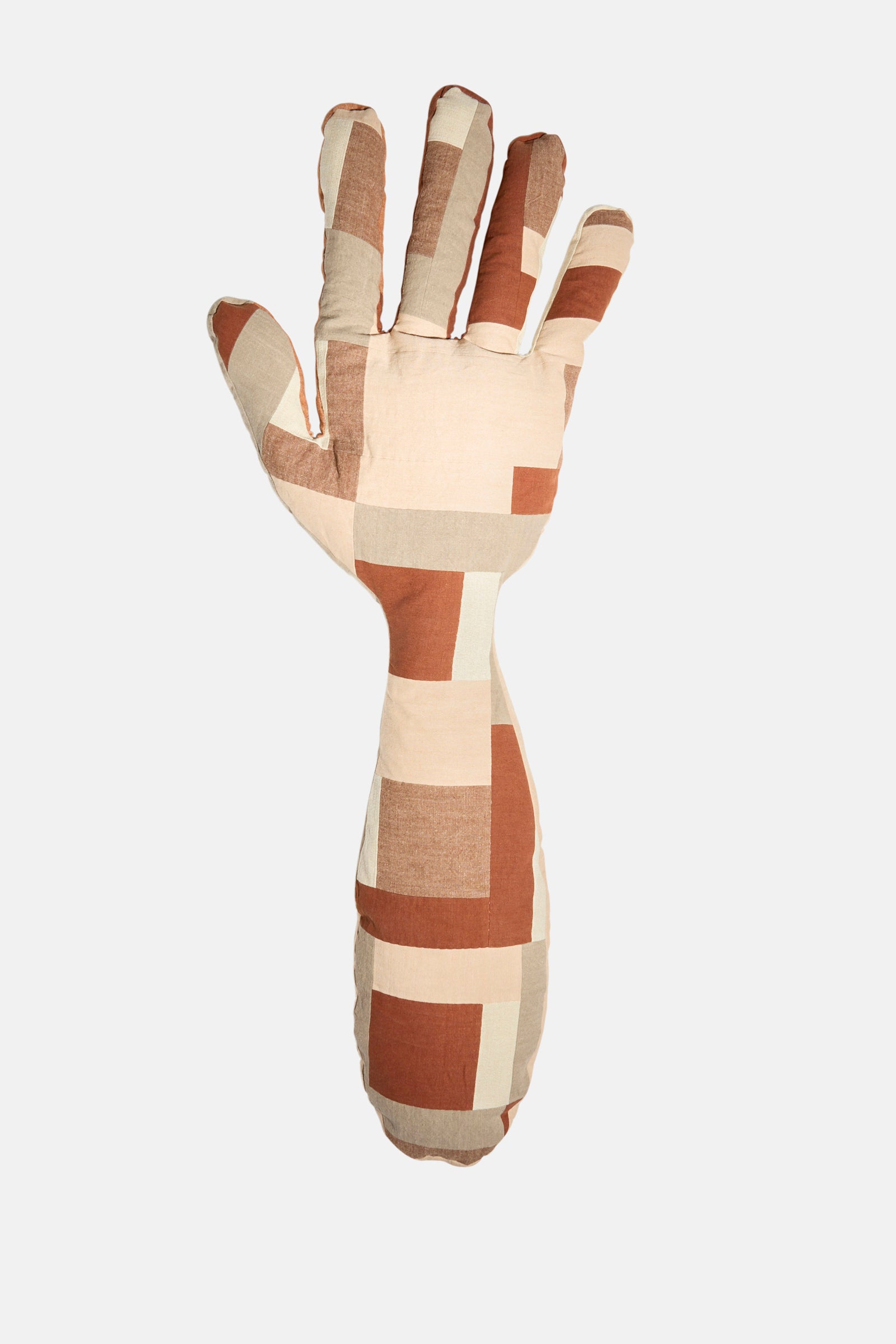 The Sonia Delaunay Tissu Simultané Giant Hand Bolster II by Wiener Times is a hand-shaped pillow with a geometric pattern in brown, beige, and cream blocks, inspired by Wiener Werkstätte design, shown on a plain white background.