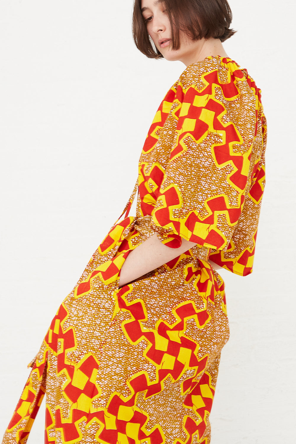 Odile Jacobs - Arielle Dress in Yellow/Red hand in pocket side detail