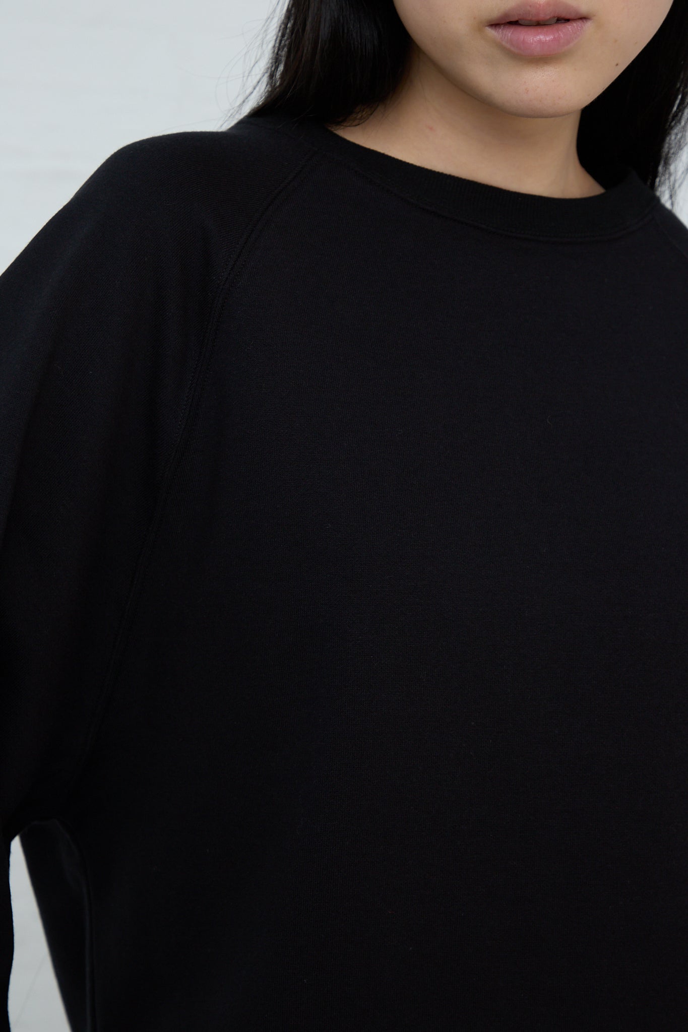A woman wearing an Ichi Cotton Knit Pullover in Black. Front view and up close.