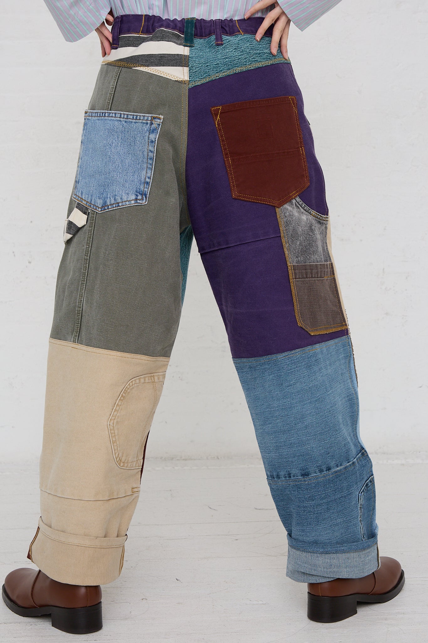 A man wearing a pair of WildRootz Reworked Jeans in Multicolor II.