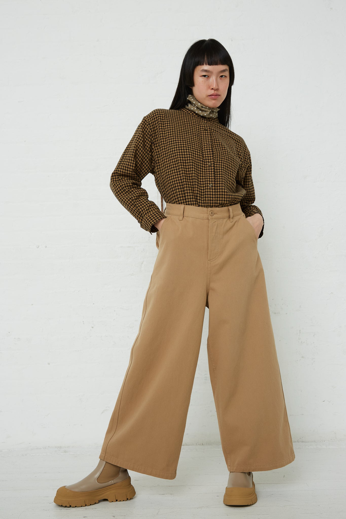A woman wearing a brown sweater and Ichi's Cotton Pant in Beige. Available at Oroboro Store.