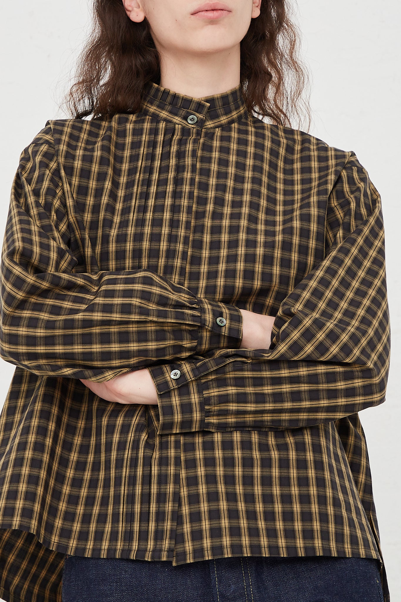 CHIMALA Pleated Stand Collar Shirt in Yellow Check - Oroboro Store | Front view and up close. Model's arms crossed.