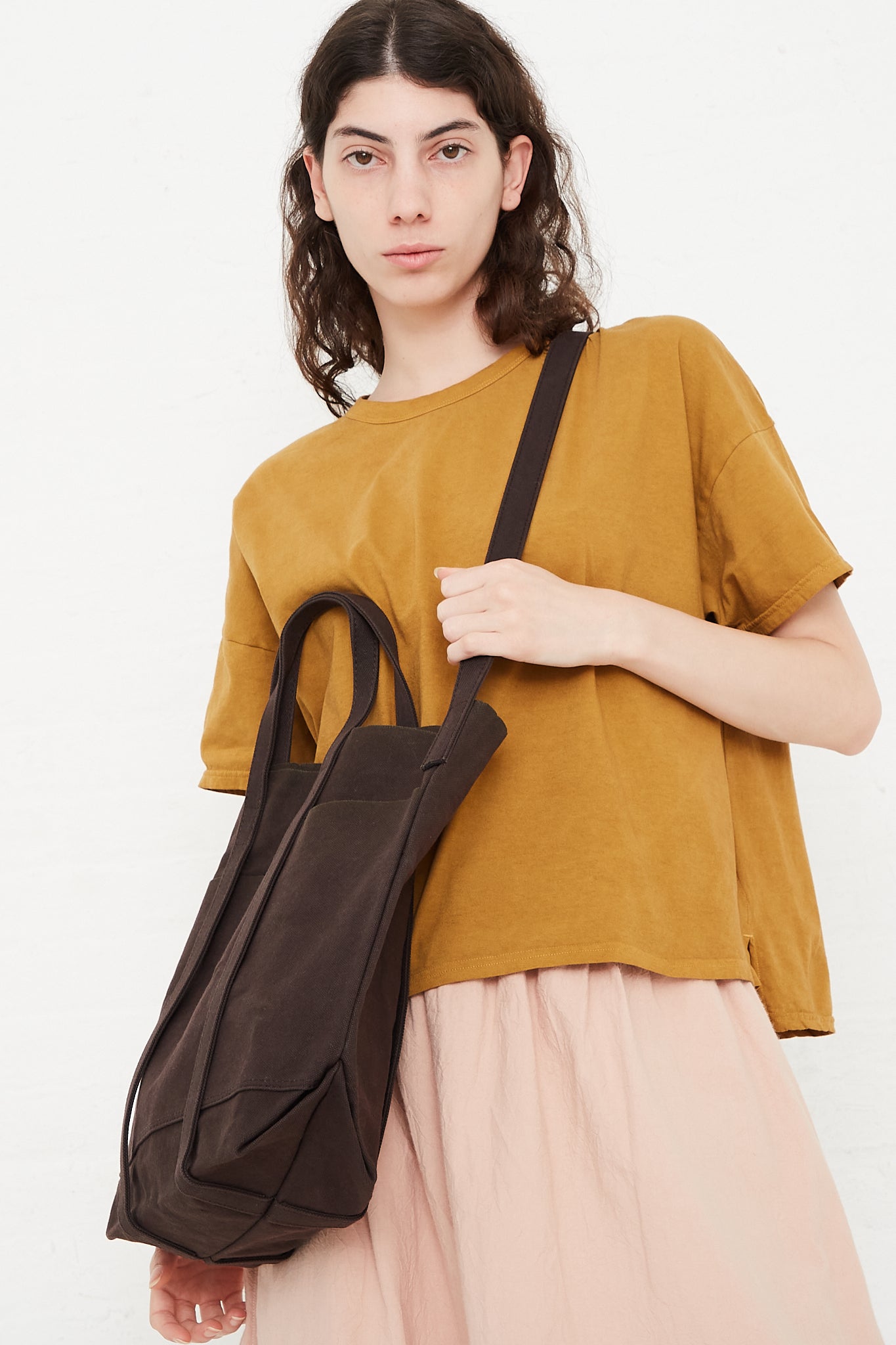 Amiacalva Light Ounce Canvas 2way Tote M in Chocolate worn across body view