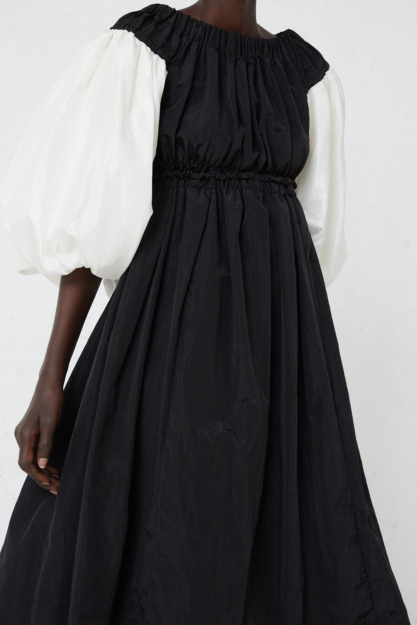 Black and white puff sleeve Taffeta Lydia Dress in Black by Rejina Pyo.