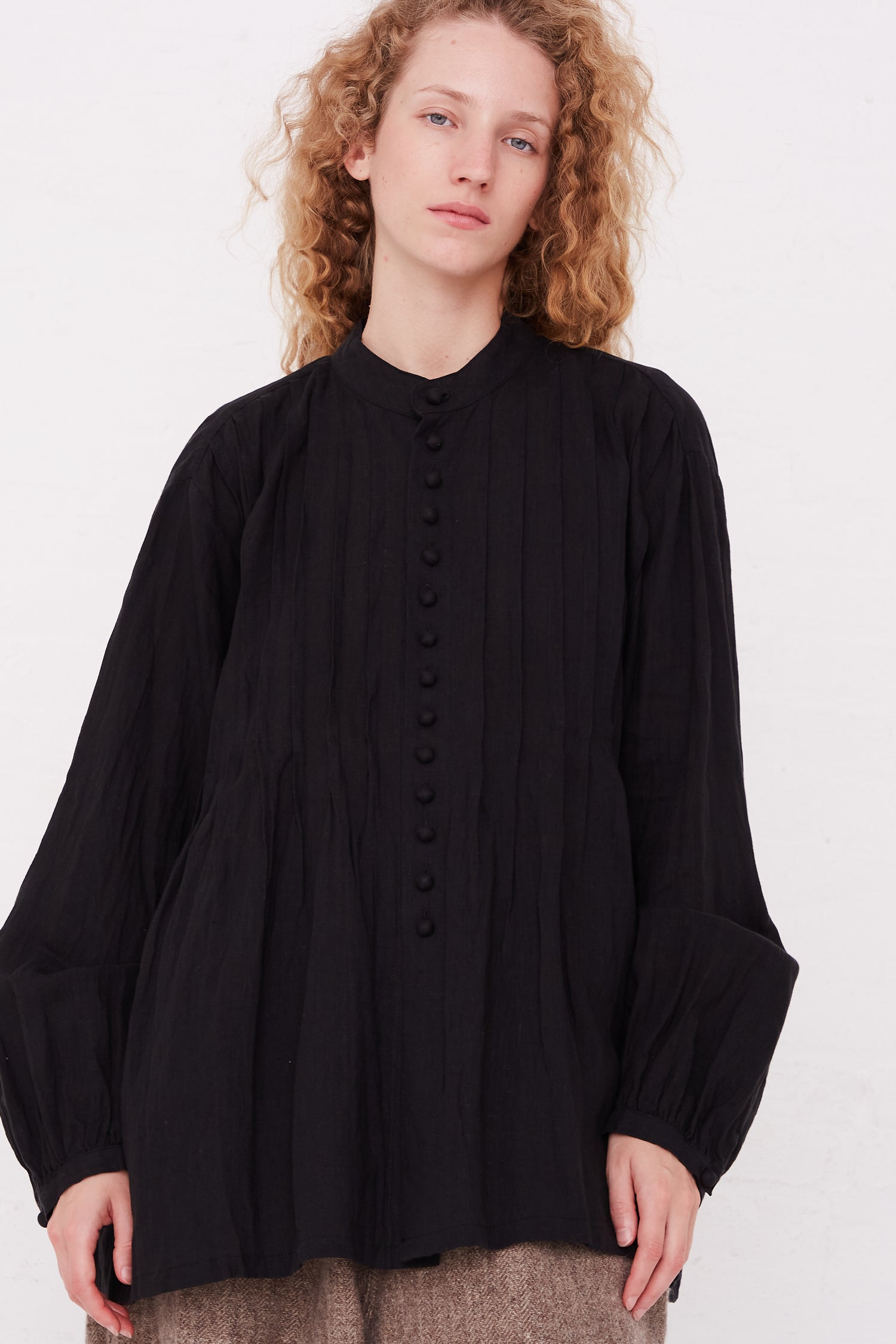 A model wearing a French Linen Shirt in Black by Ichi Antiquités.
