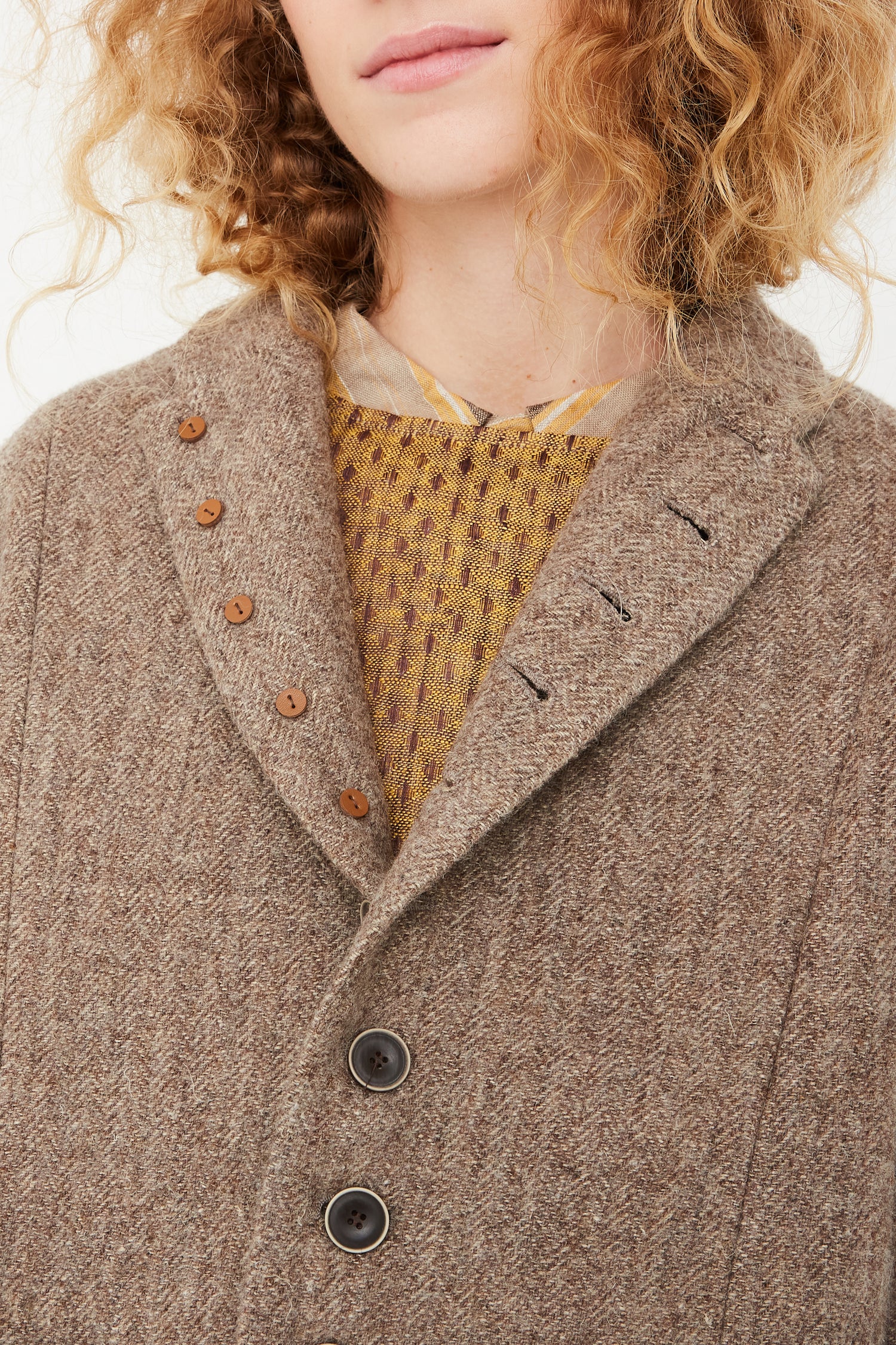 A model wearing an oversized Wool Herringbone Jacket in Mocha by Ichi Antiquités, available at Oroboro store.