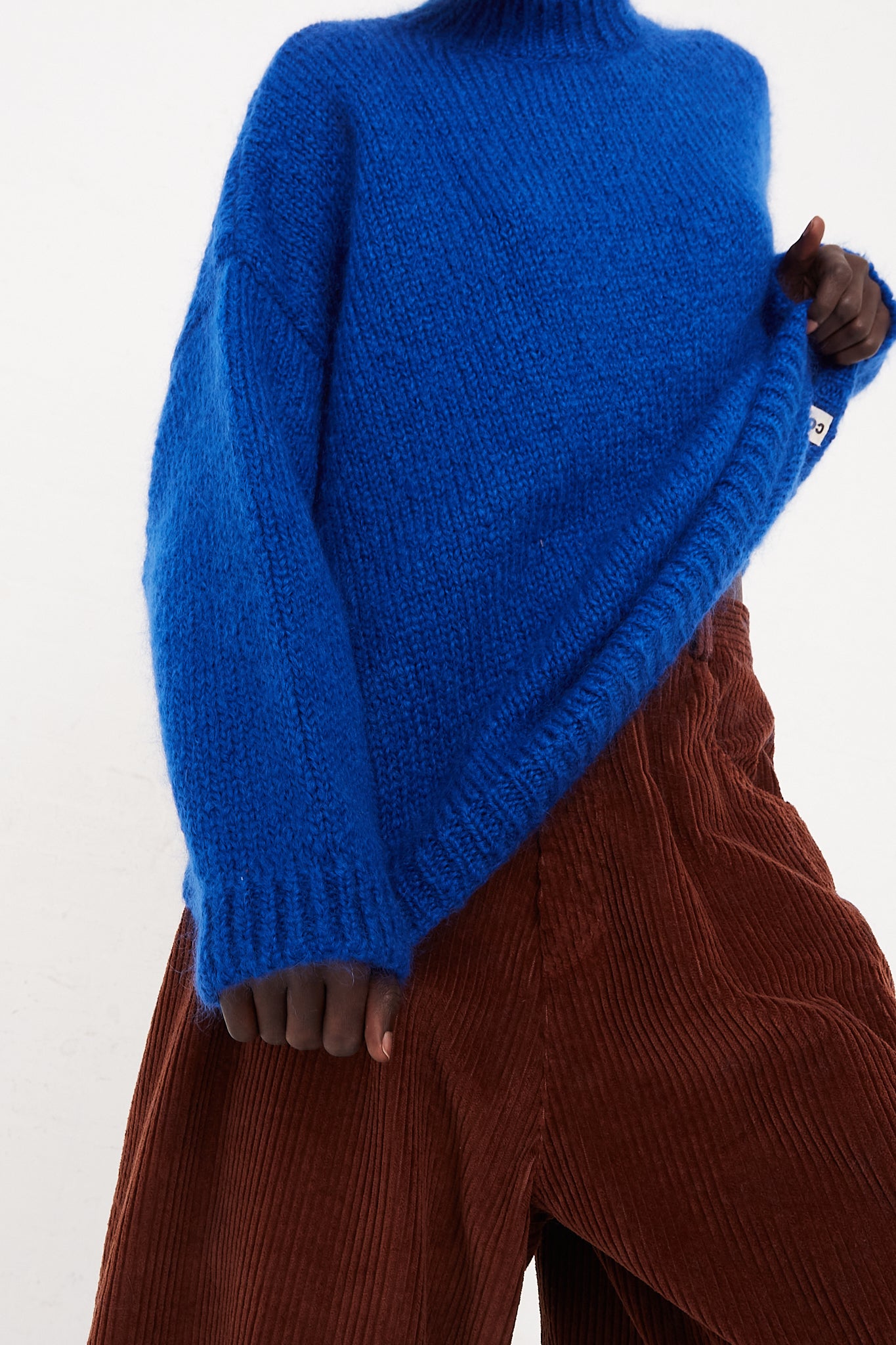 CORDERA Mohair Sweater in Blue | Oroboro Store | Front view of sweater upclose to show details on model