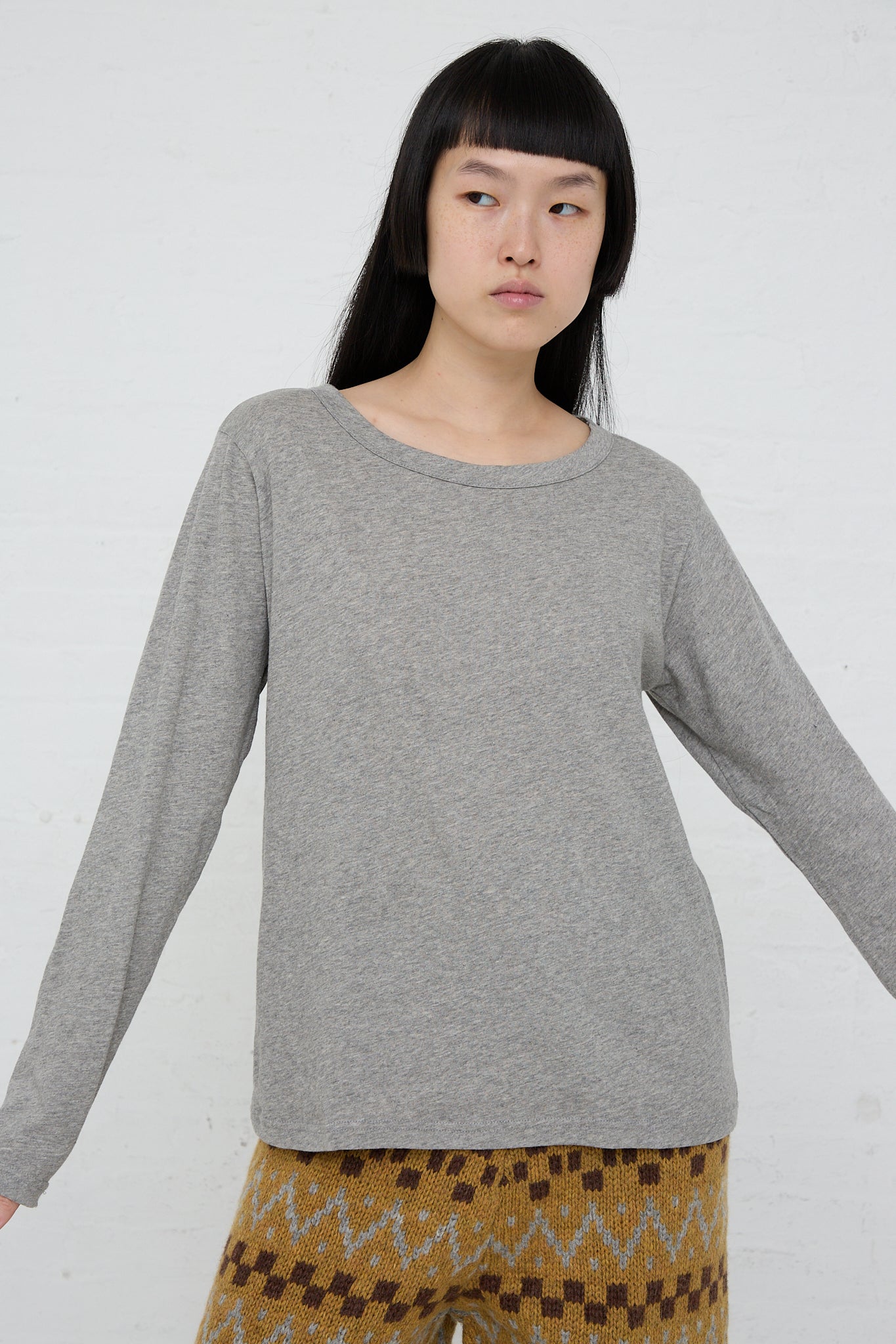The model is wearing an Ichi Cotton Knit Pullover in Gray - OROBORO STORE