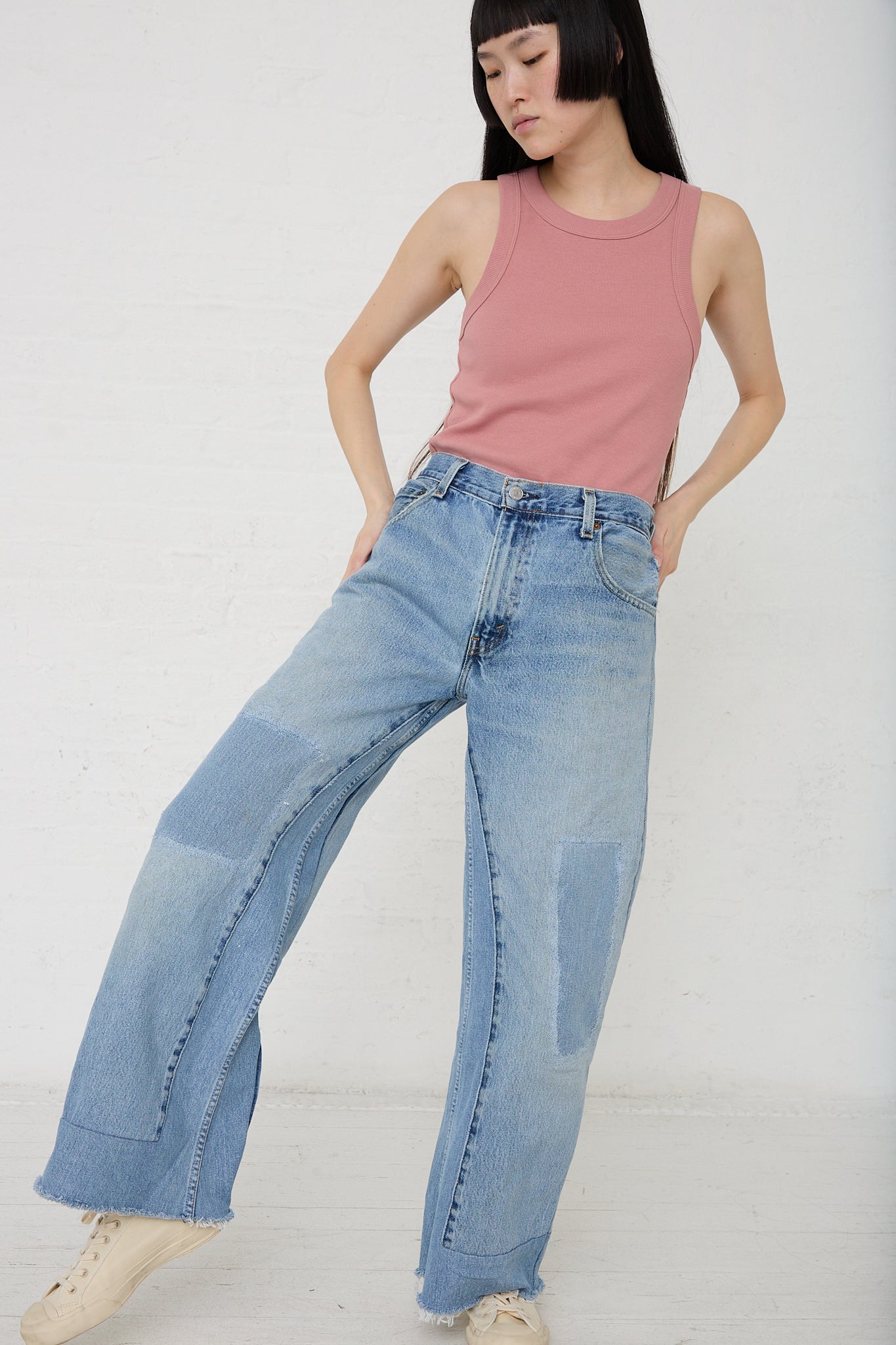 A woman wearing a B Sides Reworked Culotte in Vintage Indigo. Front view.