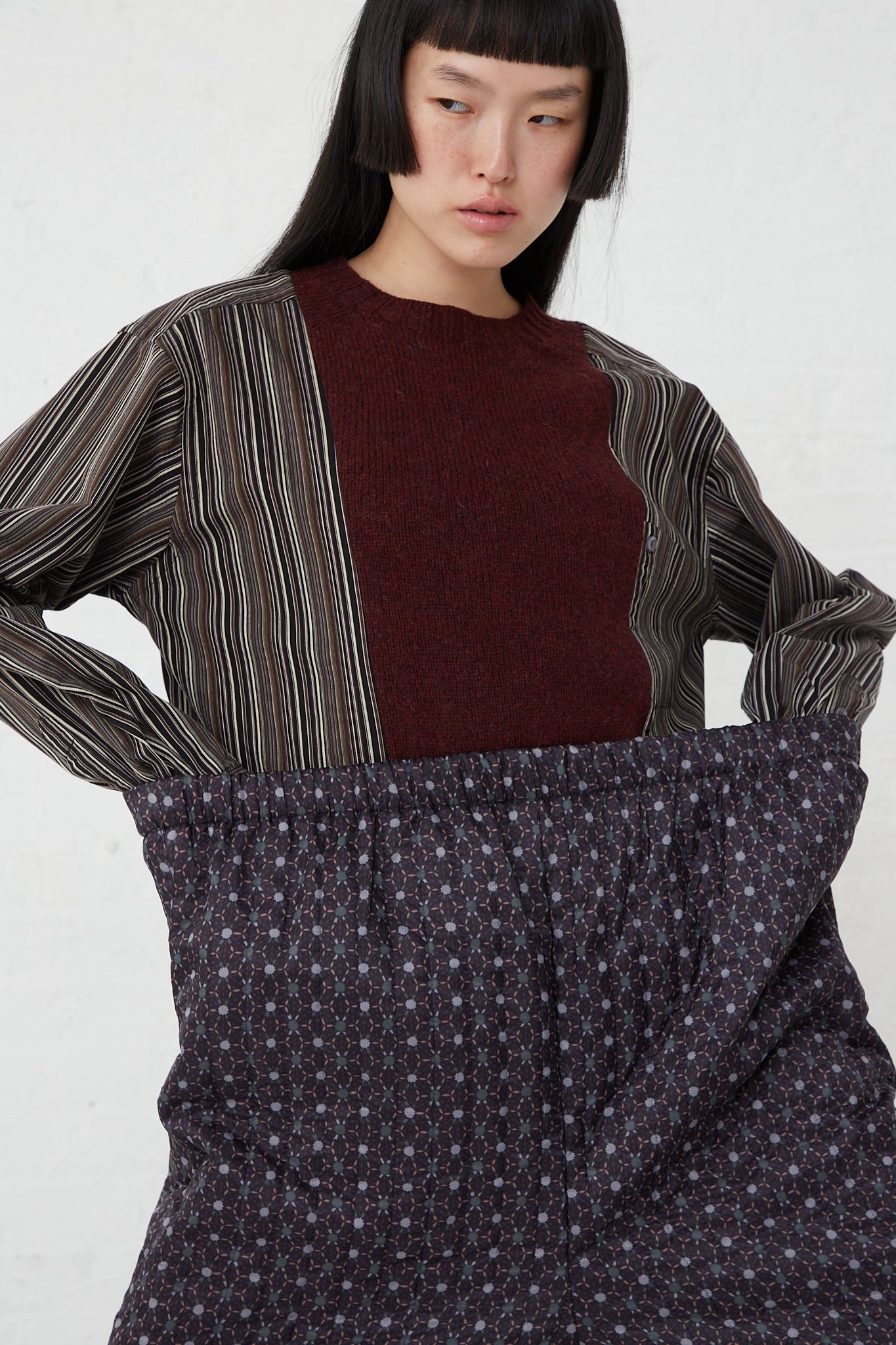 A model wearing a Monpe Pant No. 08 in Floral Print A - L by Bless with a striped pattern and an elasticated waist.