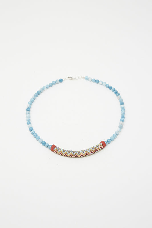 A Beaded Bar Necklace in Larimar with Robin Mollicone beads on a white background.